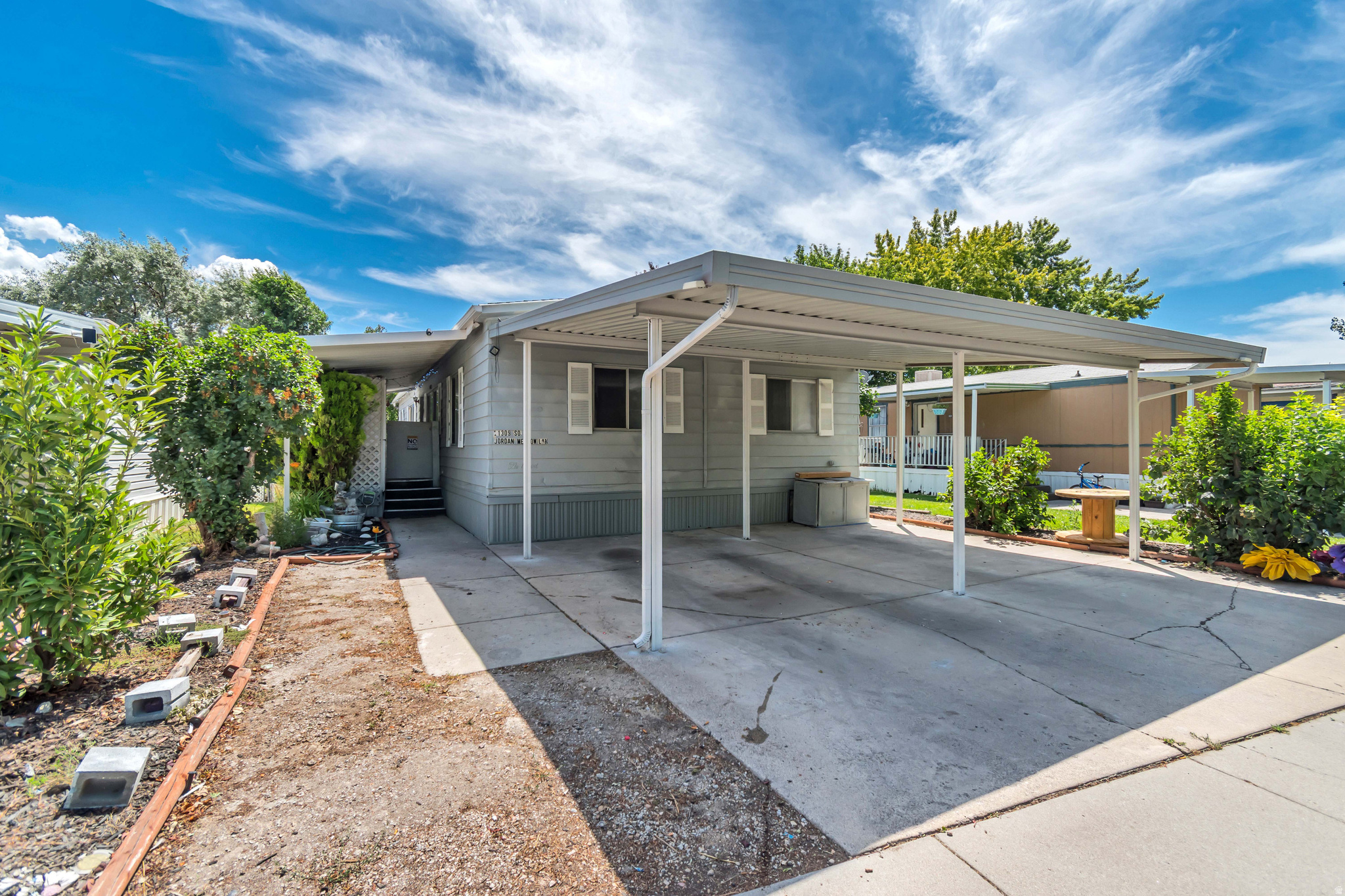 Charming Sandy home offering 3 spacious bedrooms and 2 bathrooms in a fantastic location! This well-maintained property features a functional and comfortable layout, perfect for everyday living. Step outside to enjoy the covered patio overlooking the fully fenced backyard, providing an ideal space for relaxing, entertaining, or outdoor activities. Additional highlights include a covered 2-car carport and three storage sheds, offering plenty of room for tools, hobbies, and extra storage. Conveniently located near shopping, dining, and freeway access, this home combines comfort & functionality! Buyer to verify all.