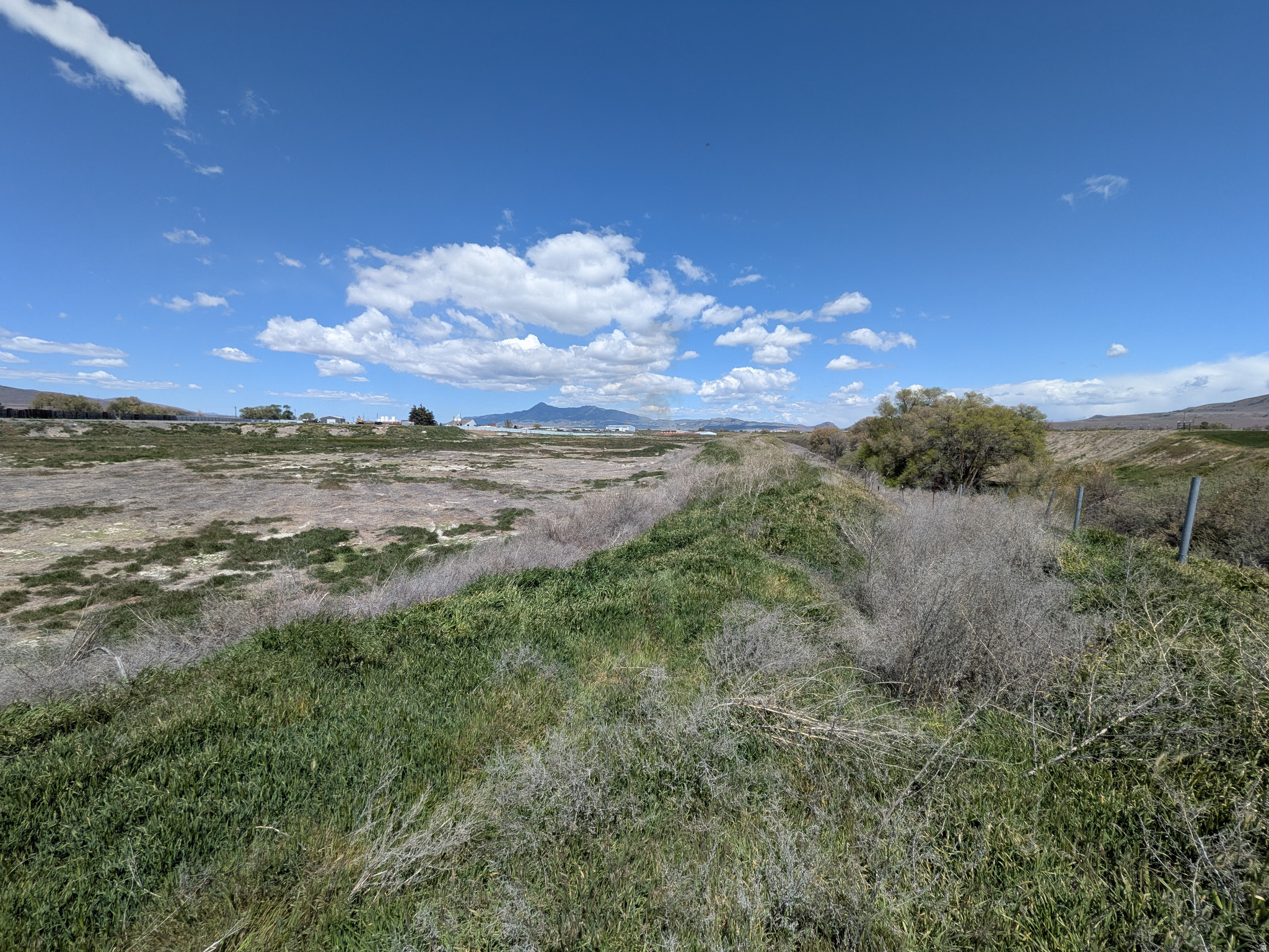 Over 26 acres of commercial/Industrial land for sale in Garland, Utah.  This could be a wonderful commercial development opportunity to start or expand your business. Previously used as a metal salvage yard, scales are still in place. Malad River is the east side property line. Seller financing available