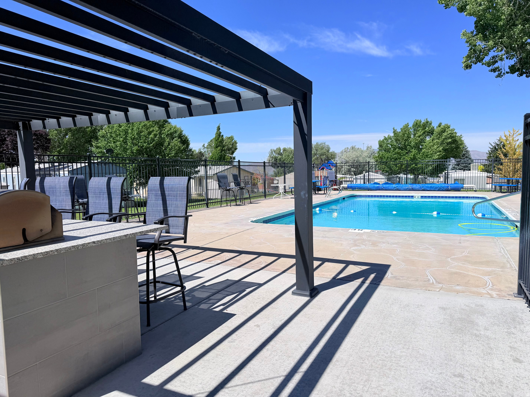 *Seller incentive. First month lot rent paid at closing* Move-in ready mobile home with a new roof in 2024, fresh interior paint, and new LVP flooring. Granite countertops in both bathrooms. Primary bedroom includes an adjoining private bath and walk-in closet. Covered deck with new carpeting. Large fenced yard with mature landscaping. Shed with electricity and workbench. Refrigerator and washer and dryer included.
