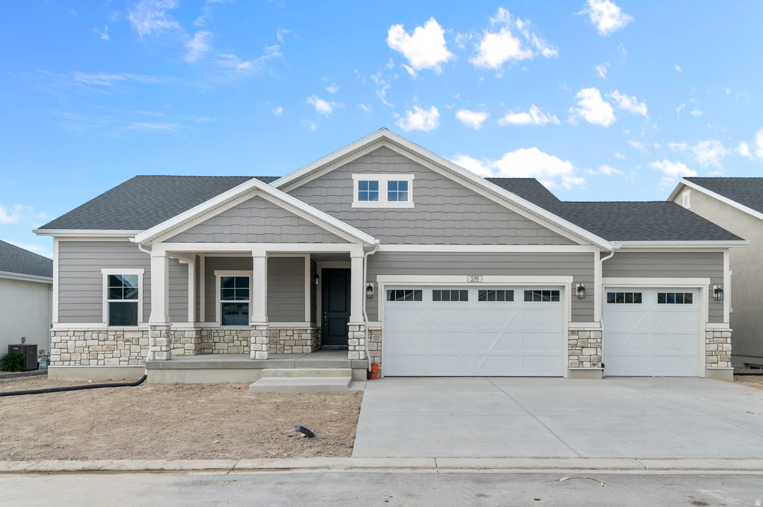 Discover this beautiful Cottonwood home with timeless style and modern efficiency all located in a great active adult gated Stansbury Park community with access to walking trails, community pool and pickleball courts! Featured you will find a practical modern kitchen with white laminate cabinets, quartz countertops, and stainless steel gas appliances. Durable flooring highlights laminate hardwood, tile, and carpet throughout. Enjoy the convenience of a 3-car garage, expanded patio, and energy-efficient upgrades including a 40-gallon water heater. Interior highlights also include can lighting, Christmas light outlets, wood stair railing, 2-tone paint, and Craftsman base & casing. The owner's bathroom showcases cultured marble shower surrounds with elegant brushed & satin nickel hardware for a polished finish. Comes fully landscaped that is maintained by the HOA for easy care, hassle free living!