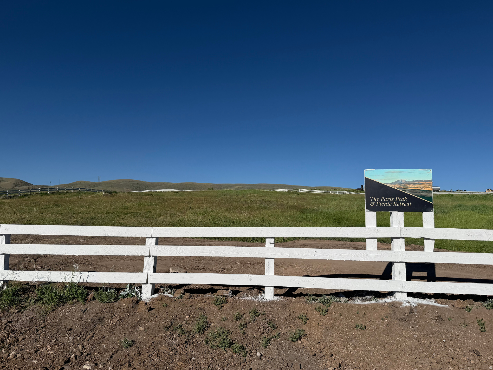 The Paris Peak & Picnic Retreat lot (Lot #3)! 2.7 acres of a rural homesite paradise, nestled at the base of the foothills in Bear Lake County. Building your home here with the scenic views of the western mountain range overlooking the valley and hills below will be a no-brainer! You'll love the split rail white fence around the full property, the gradual slope, the canal meandering through, and the footbridge already in place to allow access to anywhere on the lot. Shared approach from Sharon Loop already in, and final plat recording and approval anticipated within less than 30 days. Preliminary approval already received! Power at road and to be stubbed to each lot. Sharon Loop is a paved, year-round maintained road, so this is the ideal lot for your year-round residence or vacation/second home! Call and check it out today!