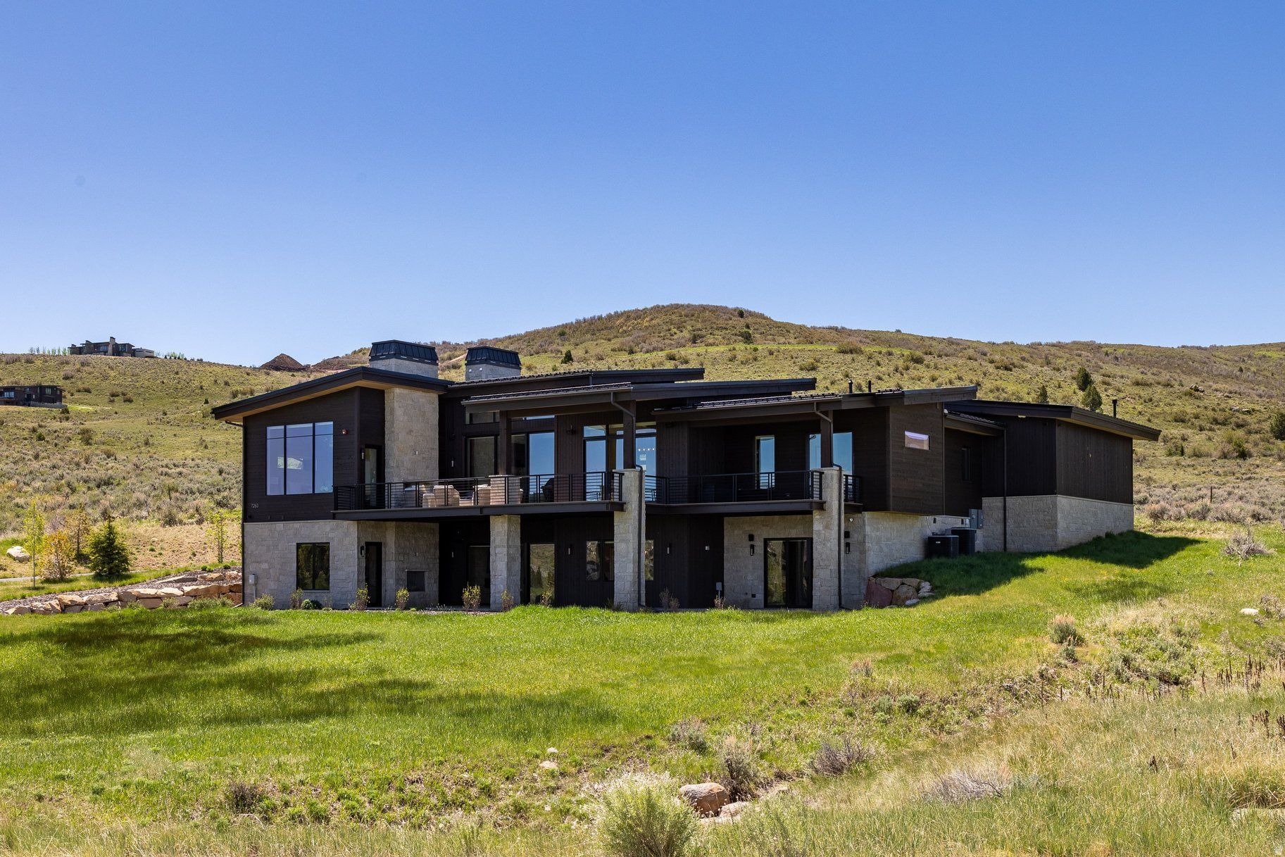Experience refined mountain luxury in this exceptional 6-bedroom/7-bathroom home in the private, gated community of Victory Ranch. Set on 1.49 acres and encompassing 6,172 square feet, this thoughtfully designed residence offers an extraordinary blend of elegance, comfort, and convenience. The main level features both a luxurious primary suite and a junior primary suite, creating the perfect layout for multi-generational living or hosting long-term guests. A dedicated office provides a quiet and inspiring workspace, while expansive floor-to-ceiling windows flood the home with natural light and frame breathtaking views of the Rock Cliffs and surrounding landscape. At the heart of the home, the oversized chef's kitchen is designed for both everyday living and grand entertaining. Outfitted with premium Wolf and Sub-Zero appliances, quartz countertops, an expansive island, and a fully equipped butler's pantry, this space seamlessly connects to the dining and great room areas with gorgeous wide-plank white oak hardwood floors and is anchored by one of five stunning fireplaces throughout the home. The lower level is an entertainer's dream, featuring a spacious gathering room with a second kitchen and bar area, ideal for hosting family and friends. Radiant heat ensures comfort year-round, complemented by forced air conditioning throughout the home. Additional luxury features include oversized decks, a heated courtyard, central vacuum system, Hunter Douglas electric shades, and a sophisticated Control4 home automation system for effortless living. In addition to 6 bedrooms and a dedicated office, you will find a flex room on the lower level which has been pre-wired for a golf simulator, can be used for even more storage or turned into a theater room, or exercise room - the possibilities are endless! Car enthusiasts and outdoor adventurers alike will appreciate the oversized three-car garage with a dedicated storage room, and an oversized interior mudroom for all your gear. Beautiful new landscaping enhances the home's curb appeal and outdoor enjoyment. Offered furnished with warm and inviting Natural Instincts dcor, this remarkable property is a rare opportunity to own a turn-key mountain retreat in one of Utah's most sought-after private communities. Victory Ranch is a private, four-season community amidst 6,250 pristine acres along four miles of the Upper Provo River. Amenities include an 18-hole Rees Jones-designed golf course, world-class fly-fishing, 30+ miles of mountain biking and hiking trails, 5-stand shooting facility, 4x4 adventures, snowmobiles, ice skating rink, backcountry yurts, fishing ponds, multiple restaurants, a ski-in/ski-out lodge in Park City and more than 3,500 acres of untouched backcountry. The Post Clubhouse includes a gorgeous lounge, our concierge, heated pool, hot tubs, fire pit and Outfitter store. The Barn Clubhouse features a Pizza and Ice Cream Parlor, General Store, Art Studio, Game Room and Indoor Basketball and Sport Court as well as a Fitness Center, Wellness Bar and Spa. The heated swimming pool, waterslide, bocce ball court, tennis, pickle and paddle courts, tennis warming hut, and event lawn will be sure to provide hours of family fun. Victory Ranch is approximately 15-minutes from Deer Valley and 25 minutes to Park City.