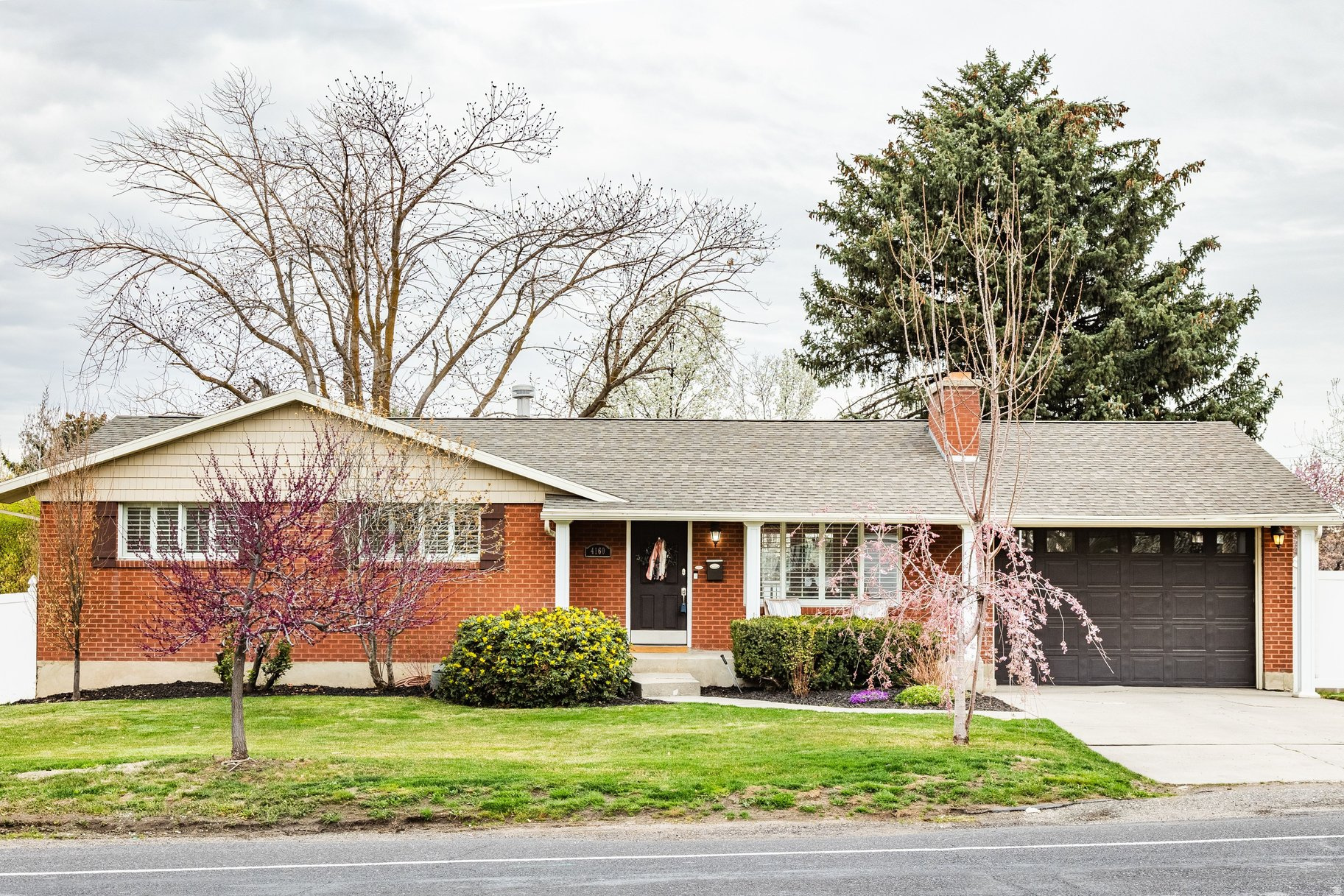 This refreshed rambler in the heart of Holladay is ideally located near top-rated schools including Howard Driggs Elementary, Olympus Jr. High, and Olympus High School. Fresh paint throughout gives the home a bright and clean feel. On the main level there is a well-appointed master suite featuring dual sinks and a spacious walk-in closet. The kitchen is equipped with LG appliances, all of which are included. Downstairs, a large family room provides the perfect space for gatherings or movie nights. Step outside to a fully fenced, peaceful backyard designed for both privacy and enjoyment, complete with a spacious deck for entertaining. Convenient access to the I-215 belt route makes commuting a breeze.
