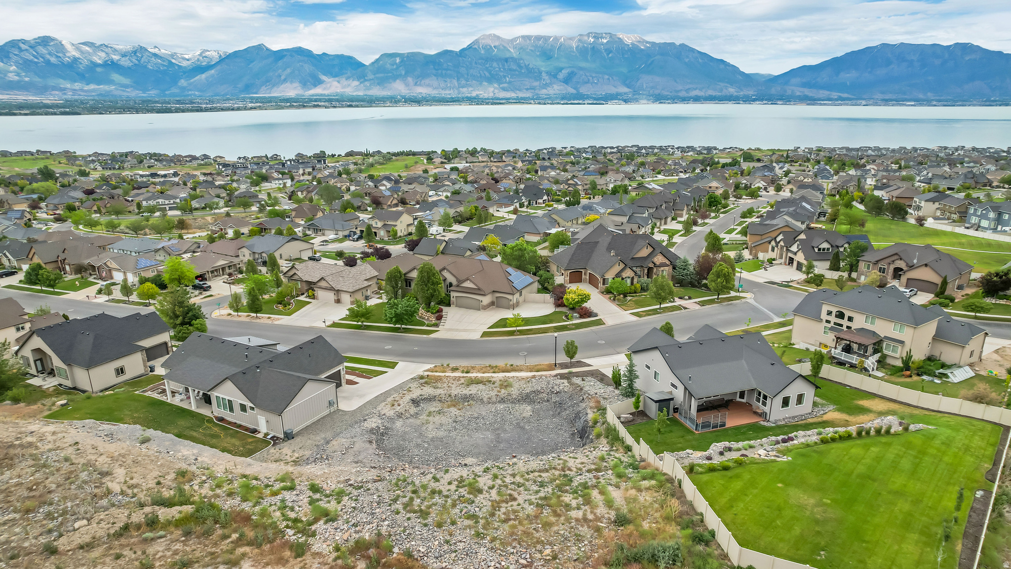 Fully improved Stillwater lot with incredible Utah Lake, mountain & valley views. No builder requirement-bring your own builder. Seller paid nearly $20K in permit/impact/connection fees and $80K in excavation (excavation is mostly complete for the attached plans); ALL information is provided as a courtesy only, and Buyer is advised to independently verify all information.