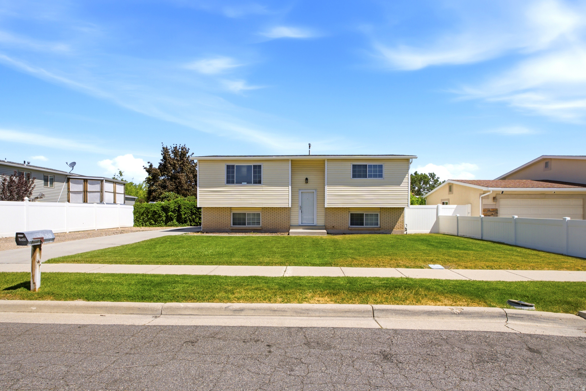Come view this clean and well-maintained 3-bedroom, 2-bath split-level home in West Valley City. The open floor plan features a spacious kitchen complete with a dishwasher, ample cabinet space, and a convenient peninsula that overlooks the living area. Downstairs, you'll find a large bedroom that provides plenty of space for entertaining, relaxing, or creating a home office or recreation area. Step outside to a fully fenced backyard featuring both a deck and patio area, perfect for outdoor gatherings and summer BBQs. The property also offers plenty of off-street parking. Located within the Granite School District, this home is conveniently situated near schools, restaurants, shopping, grocery stores, and other everyday amenities. Don't miss the opportunity to make this wonderful West Valley home yours!