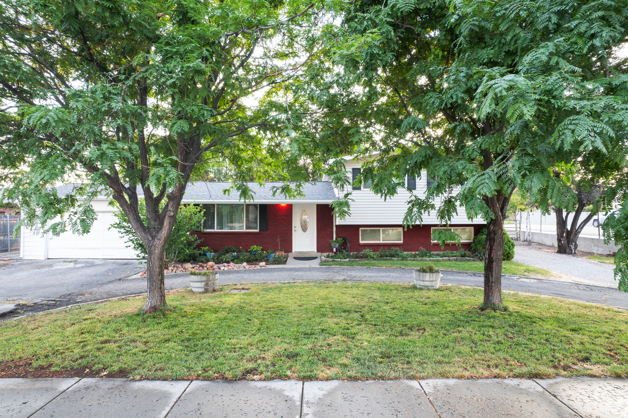 Welcome to this 4 bed 1 and 1/2 bath home! Discover comfort and room to grow in this beautifully maintained property on a 0.42-acre lot. With 2 living rooms, a spacious yard, and plumbing to add a third bathroom, this home has plenty of room to grow! Zoned to allow for horses (or livestock) on the property, the options are endless. The back yard features plenty of space for RV parking including a septic tank and RV electrical hookups, and a vegetable garden. Enjoy the added bonus of a backyard chicken or dog run, perfect for fresh eggs and a touch of country living. Complete with fruit trees, raspberries, and beautiful flowers that greet you as you walk up to the front door, this is the perfect place to call home.  All information herein is deemed reliable but is not guaranteed. Buyer is responsible to verify all listing information, including square feet/acreage, to buyer's own satisfaction.