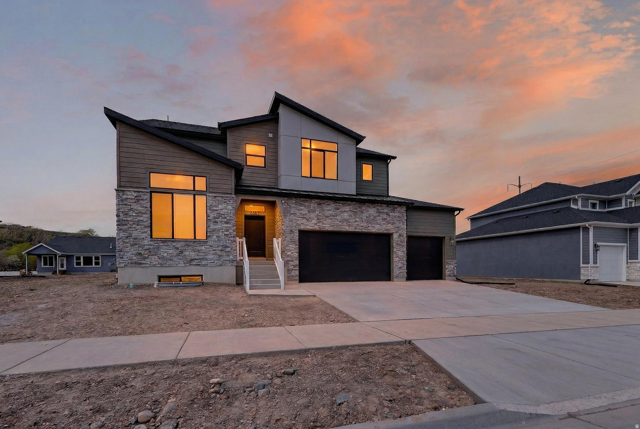 This gorgeous "Glacier" home design has it ALL!!! 3 spacious great rooms, large office, beautiful kitchen with upgraded quartz countertops, huge pantry, 6 spacious bedrooms, tiled fireplace, dual heating/cooling systems, covered patio, storage galore, 4 car garage & Plumbed for future kitchen in basement. Riverwood is South Weber's newest and most popular community. Incredible home warranty included. We are offering $12,000 + incentives - ask for details! Come see the stunning features this home and community have to offer!