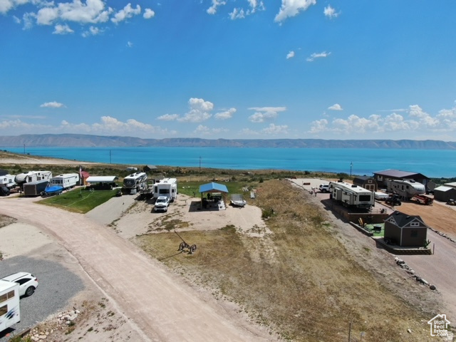 BEAR LAKE RV PARK - SPECTACULAR LAKE VIEWS ON 2 DEEDED LOTS. Turn-Key Lake Legacy | Covered Pavilion | Storage. Own some of the most breathtaking Bear Lake views available from these two adjoining deeded RV lots in an established RV park. This exceptional property offers everything needed for immediate enjoyment and could become your family's cherished Bear Lake legacy. Property Highlights: Two adjoining deeded RV lots. Spectacular panoramic Bear Lake views. Large grassy area overlooking the lake - perfect for family gatherings. Established RV park with amenities and community. Included Improvements: Large covered pavilion for outdoor entertaining. Storage shed for equipment and supplies. Landscaping and mature grass areas. True Turn-Key Opportunity: Everything included for immediate occupancy. Just bring your groceries and start enjoying. No setup required. Perfect for weekend getaways or extended stays. Ideal For: Families seeking a Bear Lake legacy property. Investors in recreational real estate. Anyone desiring premium lake views at an affordable price. Don't miss this rare opportunity to own premium Bear Lake property at a truly affordable price!