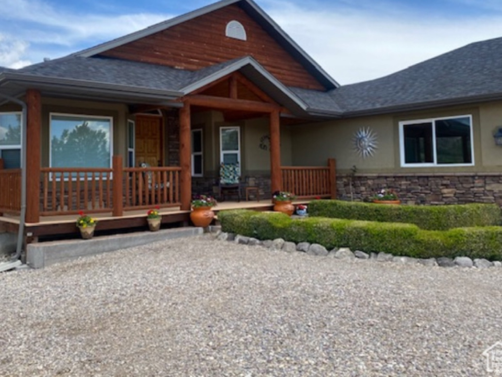 Gorgeous 3 bedroom/4 bath 3800 sq. ft home and 83 total acres with approx. 80 acres of farmable acreage. This incredible home and property is in a great location nestled at the base of the mountains with excellent hunting and recreational amenities nearby!  The home features a grand entry way, vaulted ceilings, fabulous kitchen with granite countertops, huge master bedroom and basement bedrooms, great room, fully finished daylight basement, bar and oversized family room with large fish tank, and pellet stove. Enjoy the views from the large trex deck with log railing overlooking the valley. There is also a 36x24 fully enclosed heated shop with concrete floors and two 24x14 bays with enclosed covered parking on each side with overhead doors. There shop also has a kitchenette and bathroom/shower that could be used as additional living space. Must See! This is an excellent opportunity to enjoy country living! Additional land available.(See MLS #2140496)
