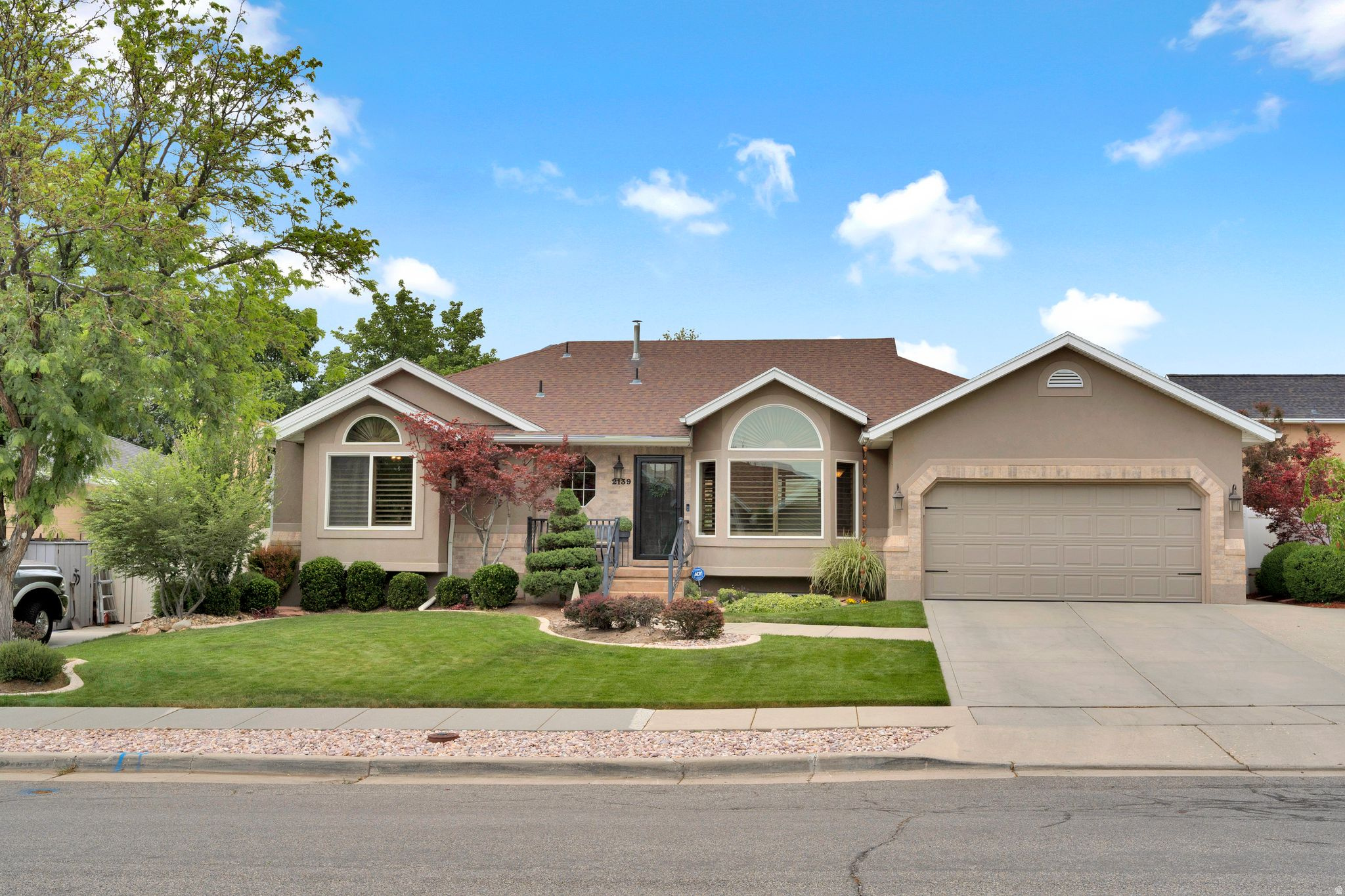 This meticulously maintained home showcases exceptional curb appeal and attention to detail throughout. The updated, spacious kitchen features new cabinet fronts, granite countertops, walnut flooring, stainless steel appliances, and pantry roll-outs. Tastefully updated bathrooms include double sinks in the primary suite and a sizable walk-in shower. Designed for entertaining, the finished lower level offers a fabulous gathering space complete with a second kitchen. Heatilator fireplaces on both levels. Additional highlights include central vacuum, whole-house water filtration, permanent holiday lighting, and newer furnace, A/C, and water heater - all just three years old. Private, beautifully landscaped backyard with a covered patio and soothing water feature. The garage includes built-in storage, workbench, sink and pull down ladder to upper storage. This home is packed with quality features and pride of ownership - a must-see!  Just 20 minutes to canyon and ski resorts!