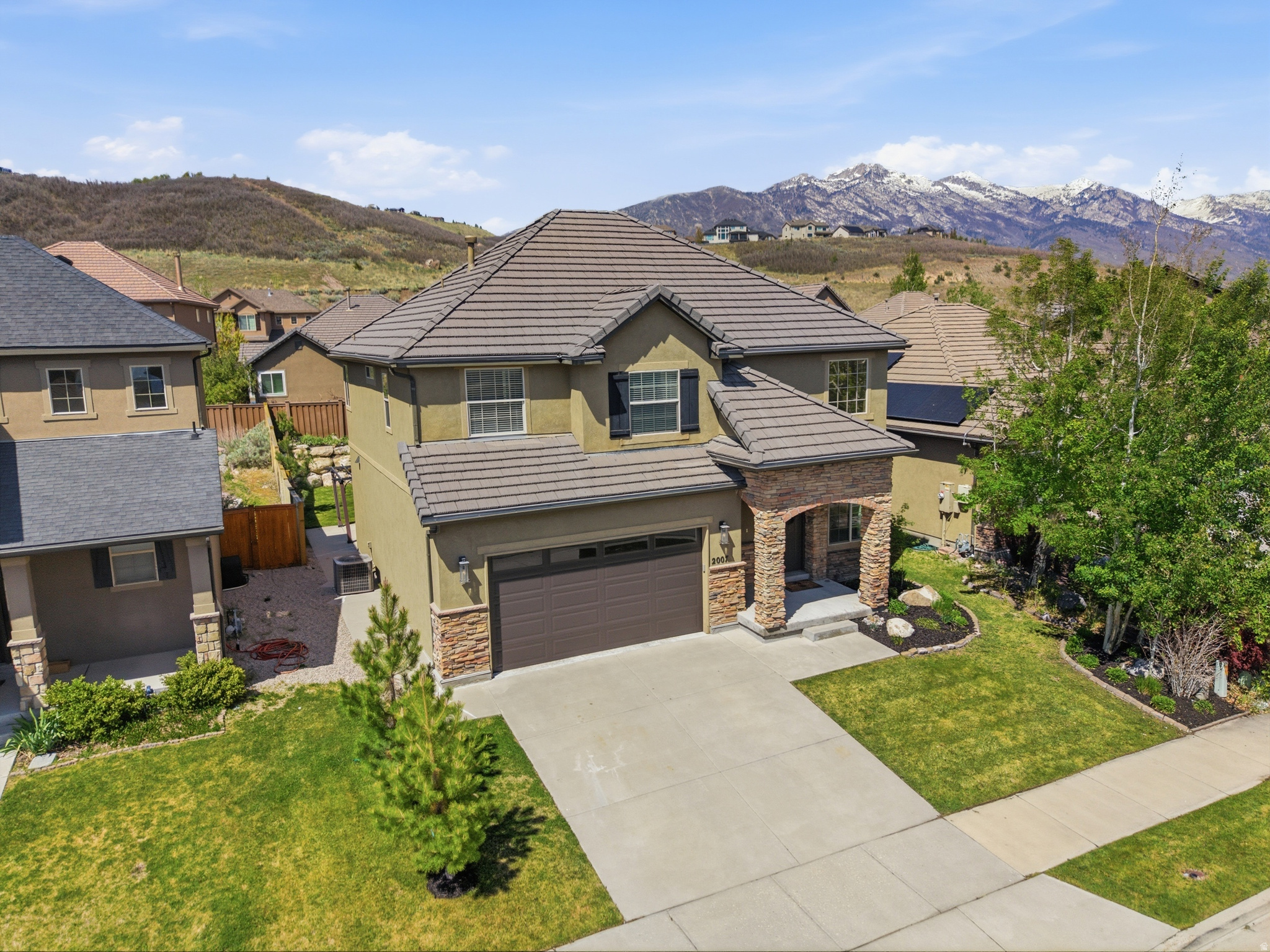 **** Open House Saturday, May 16, 2026, 11 am- 1 pm **** VA ASSUMPTION @ 3% - VA ELIGIBLE BORROWERS**** Welcome to this fabulous 2-story home in the highly sought-after Maple Hollow (Suncrest) community on the Utah County side of Draper, surrounded by breathtaking mountain and valley views and miles of scenic hiking and biking trails. Just minutes to shopping, Silicon Slopes, and Draper City if you choose. This fully finished, spacious home offers 4 spacious bedrooms and 3.5 bathrooms, thoughtfully designed features, soaring ceilings, and an open, inviting layout with multiple gathering spaces. Updates include beautiful, upgraded hard-surface flooring throughout the main and second levels, along with a high-end range, updated lighting, upgraded range hood, and refrigerator in the kitchen, creating a stylish and functional space for cooking and gathering. The spacious upstairs incorporates 3 spacious bedrooms as well as a large loft providing the perfect flex space for a second living area, office, or playroom.   The fully finished basement expands the home's versatility with an additional family gathering area, flexible bonus space ideal for a home gym or media room, plus an additional bedroom and full bathroom perfect for guests or multigenerational living. The refrigerator, washer and dryer are included! Retreat to the grand primary suite featuring an ensuite bath and a generous walk-in closet. Pride of ownership is evident throughout the home, both inside and out. Step outside to a beautifully maintained backyard, ideal for relaxing evenings, entertaining, or enjoying the peaceful surroundings.   Residents also enjoy incredible resort-like community amenities, including an expansive pool, fitness center, basketball courts, tennis courts and community parks. Don't miss this opportunity to own a stunning home in one of the area's most scenic and active neighborhoods!  Schedule a private showing today!