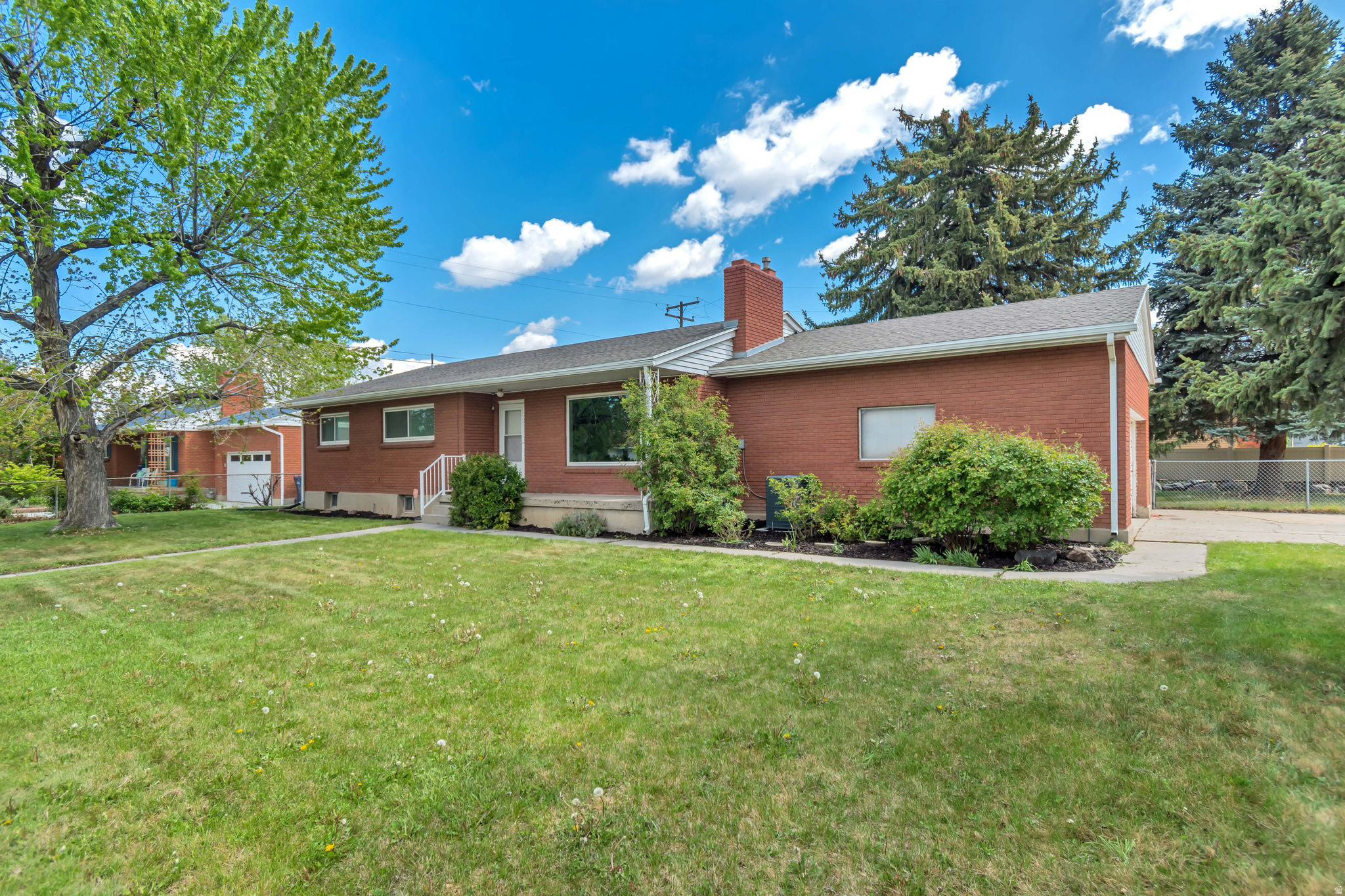 Fully remodeled 5-bedroom home in the heart of Sandy! Enjoy unbeatable convenience with nearby shopping, parks, and easy freeway access. The home includes a separate basement entrance with second kitchen and laundry, making it ideal for mother-in-law apt or an ADU.  Spacious corner lot with mature landscaping and amazing mountain views.