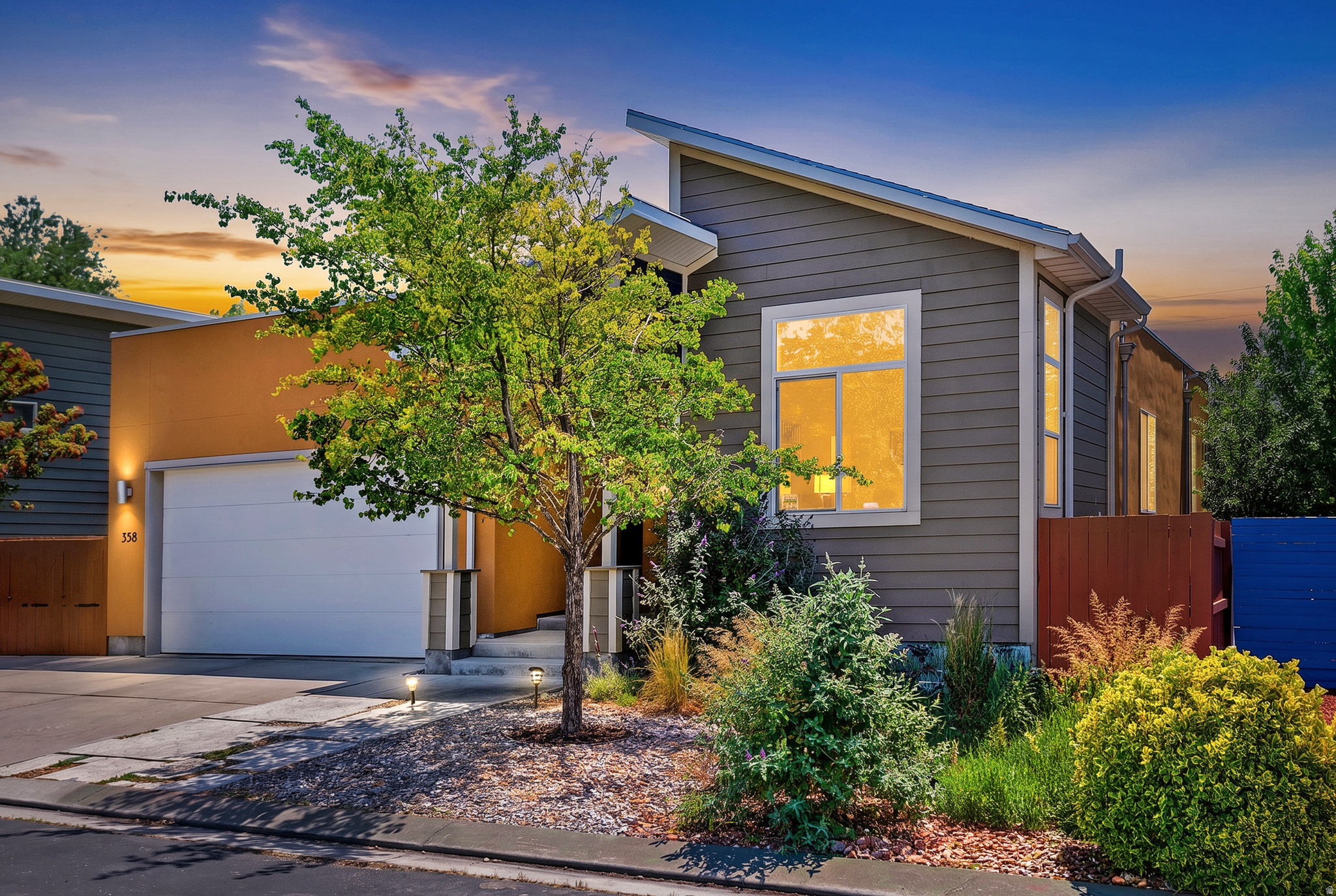 Open House June 27, 10AM-1PM! Energy-efficient rambler with single-level living in a modern Garbett-built neighborhood with no HOA. Open-concept floor plan with high ceilings and a separate entrance offering potential for a mother-in-law apartment, rental space, or home office. Geothermal heating and cooling keep utility costs low. Features include quartz countertops, premium wool carpet, Marazzi tile flooring, Cat6 hardwired internet, instant hot water, and an EV charging outlet. Covered Trex deck with ceiling fan and solar shade overlooks a fully fenced yard with mature fruit trees. Walking distance to Granite Library and minutes from downtown Salt Lake City, the airport, shopping, dining, and grocery stores.