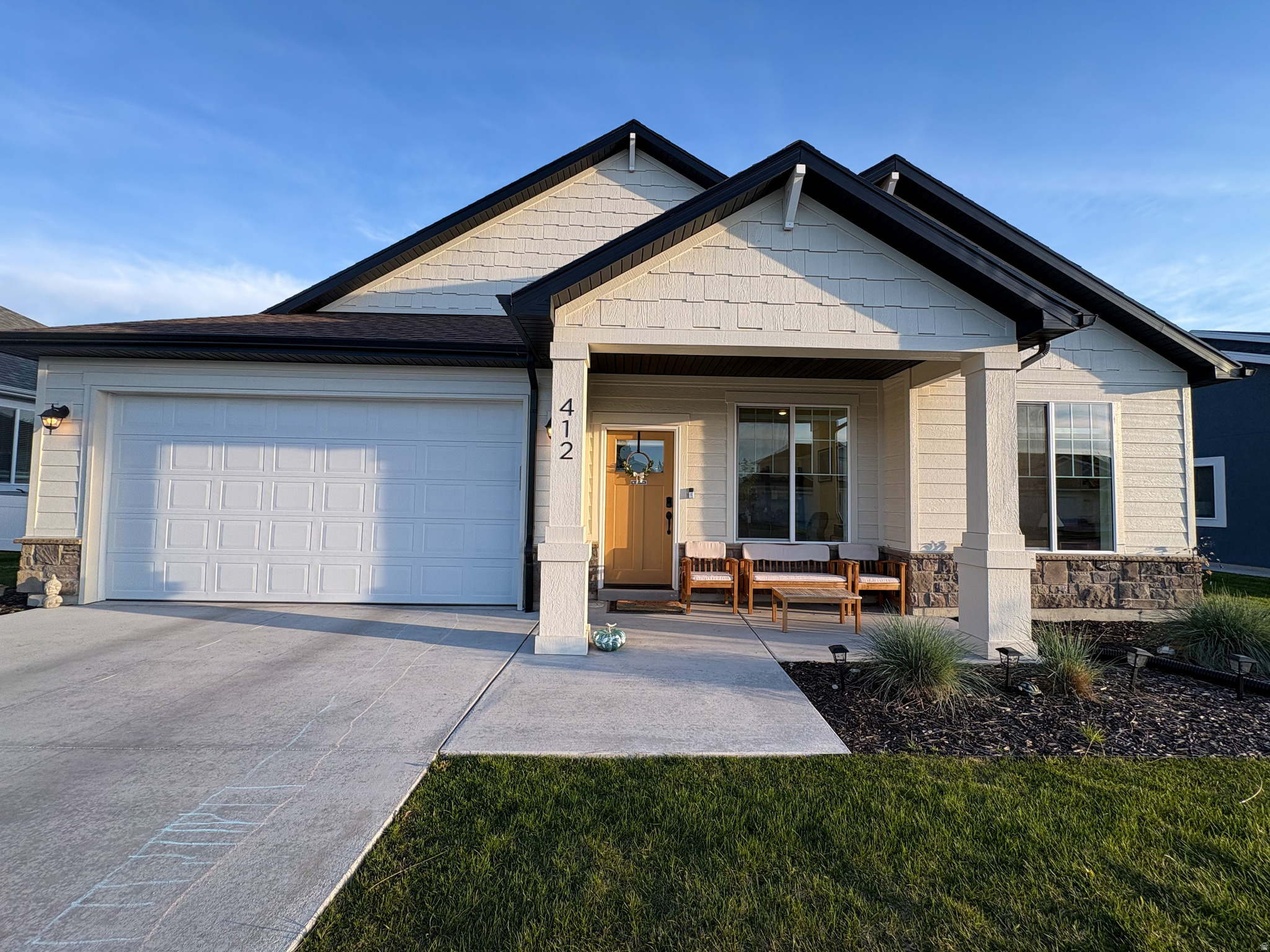 Beautifully open concept with exceptional finishes throughout, the Craftsman style Lyndhurst floor plan provides 3 bedrooms plus an additional flex space/office. Indoor/outdoor living, it has a shady front porch and covered back patio with custom wood pergola. The expansive green space area with grass and trees is just steps away outside the back door, extending the home's own lawn and views. It is just down the street from Nibley City's future 18-acre city park, now in progress. Fully landscaped, this home is in the heart of the "Active Adult" section of Ridgeline Park, with maintenance-free living, snow removal and lawn care handled by the HOA. Residents enjoy the community pool, clubhouse, pickleball court, picnic areas, and walking trails throughout.