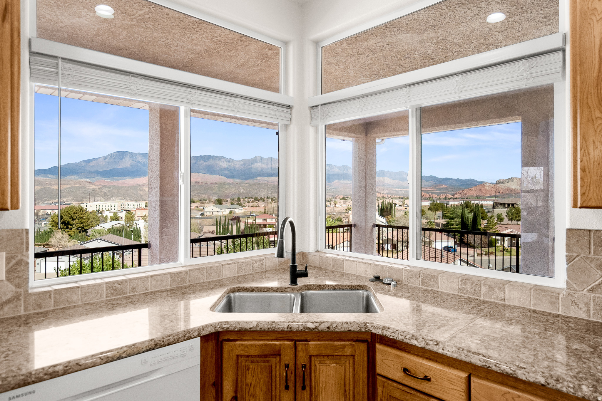 This home features 5 bedrooms, 3 bathrooms, and a 3-car garage across 3,780 sq ft. Elevated above Hurricane Valley, it offers incredible views of Pine Valley, Zion, Sky Mountain, and Cedar Mountain, framed perfectly through large kitchen windows. Enjoy a 1,000 sq ft wrap-around deck with unbeatable sunrise-to-sunset view the walk-out basement includes 2 bedrooms, a full bath, kitchenette, and a large family room-ideal for a theater, gaming, or entertaining. There's also a safe room and a backyard ready for your vision-think pool or outdoor living space. Built in 1997, the home has been updated with a remodeled master bath, new carpet, refreshed front porch, and newer windows. Additional perks include a new water heater and a garage air compressor with pneumatic lines to the deck and hobby room.  The lot below it could be negotiated in the sale for the right price. Check 2551 W Grandview Dr. VIEW LOT Hurricane, UT 84737 Tax ID: H-LGH-5-1