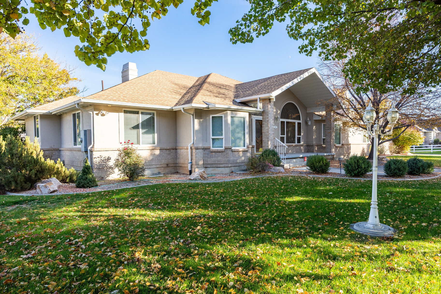 Discover this exceptional home on a full usable acre in the sought-after Wasatch View Drive! The property features a game-changing detached building (54'W x 41'D) with additional loft storage, perfect for RV/boat storage or a home-based business. The building includes four oversized doors (up to 10'W x 14'H), a climate-controlled workshop with a half bath, an RV electrical hookup, and a new 50-year roof installed in 2023. An additional 30'W x 21'D covered awning provides even more protected storage space. The home offers incredible multi-generational living potential with a separate basement entrance leading to a private suite that includes a master bedroom with an ensuite bath, two additional bedrooms, a kitchenette (easily convertible to a full kitchen), a family room, a den, a theater room, and a half bath. The main level features a spacious kitchen opening to a covered patio and deck (pre-wired for a hot tub), a large great room with a fireplace, a primary suite with a walk-in closet, and additional bedrooms, including an office space. The horse-zoned property boasts mature landscaping with fruit trees, a koi pond, a firepit area, mountain and valley views, and is fully fenced with automatic sprinklers. With 9-car equivalent garage space, RV parking, and abundant storage, this estate is perfect for contractors, hobbyists, or families seeking flexibility and space. Recent updates include new roofing and fresh carpet throughout most of the home. Accessibility features include chair lifts and 36" hallways.