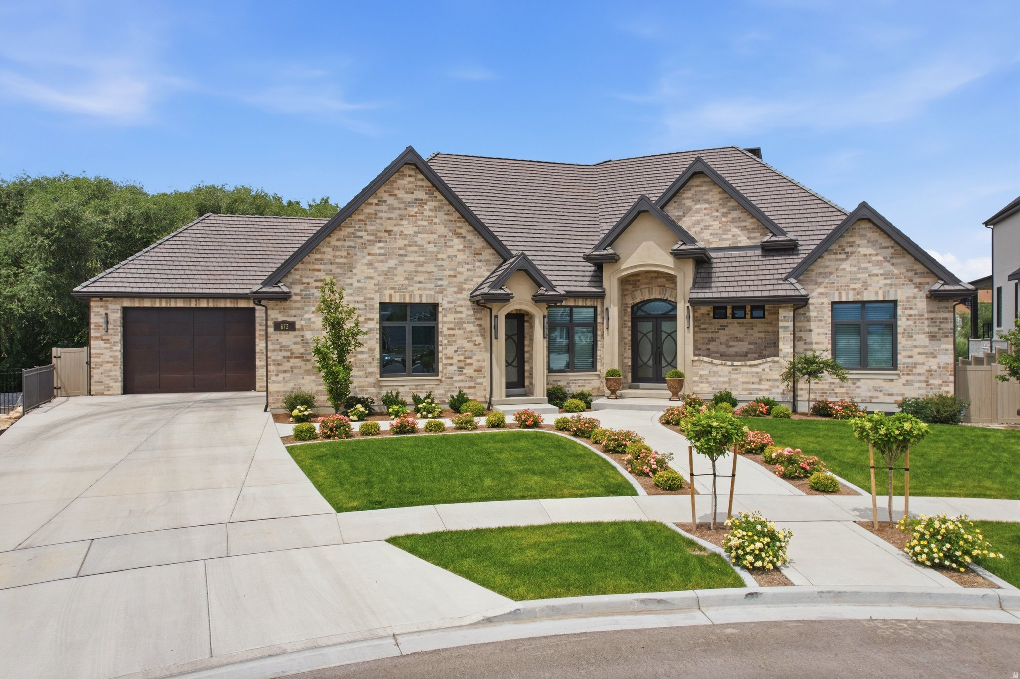 Now offered with a significant price improvement of over $400,000, presenting unmatched value for a newly built dwelling of this caliber. Secure a masterpiece today and eliminate up to two years of stress, rising costs, and construction uncertainty inherent in a project of this elite scale. Exceeding the benchmarks of a Parade of Homes winner, this showpiece sanctuary invites you to bypass the wait and BEGIN LIVING YOUR LEGACY IMMEDIATELY. Experience an unrivaled multi-generational legacy estate in American Fork, specifically engineered for the high-capacity lifestyle. This 10,380 sq. ft. Universal Design masterpiece is perfectly situated near Silicon Slopes and just 3060 minutes from world-class skiing. Enjoy 5-minute urban convenience with the total seclusion of a quiet cul-de-sac bordering the serene Greenwood Creek. Explore every detail of this estate via the Immersive 3D Virtual Tour-your gateway to experiencing the craftsmanship and scale of this home from anywhere. BESPOKE CRAFTSMANSHIP: Every inch of this home must be seen to be appreciated. Highlights include a stunning custom ceiling accent in the Great Room, custom woodworking throughout, ambient mood lighting, and elegant custom display cabinetry. High-end functionality meets unique custom details-such as a 13-foot "hidden" Christmas tree storage closet designed for effortless holiday transitions. Comfort is paramount with heated bathroom floors and a covered deck equipped with integrated ceiling heaters for year-round creek-side enjoyment. THE ULTIMATE HANGAR: Rare 6-car garage with epoxy flooring, 3 EV charging outlets, and a 14-foot RV door designed for a premier adventure fleet, luxury recreational assets, or your beefed-up truck. DUAL GOURMET KITCHENS: Masterfully designed for the culinary artist (and a perfect Kosher kitchen solution), featuring 6cm Taj Mahal Quartzite, premium paneled appliances, and 10-foot islands. The main kitchen features a high-performance induction cooktops for precision heating and enhanced safety-a perfect complement to the professional steam oven, ice maker, and walk-in pantry. Includes a unique custom cabinet for hanging tablecloths and deep storage drawers throughout. INCLUSIVE LUXURY: Full Universal Design with 36" hallways, roll-in showers, and a dedicated ADA-accessible in-law suite. ENTERTAINMENT & INFRASTRUCTURE: This estate is engineered for luxury and high-capacity living, featuring 10-foot basement ceilings, a dedicated theater room, an indoor sports court, and a Bullfrog swim spa with an electric cover. Built for ultimate resilience and performance, the home includes a whole-home water filtration system with 600 gallons of emergency water storage, Cat 6 wiring, 3 HVAC systems, and dual-generator wiring. A detailed upgrade list exceeding $500k is available upon request.  Available Tour: Click the 'Tour' or 'Virtual Tour' icon for a full 3D immersive walk-through. OWNER/AGENT. Square footage figures are provided as a courtesy estimate only and were obtained from appraiser.  Buyer is advised to obtain an independent measurement.