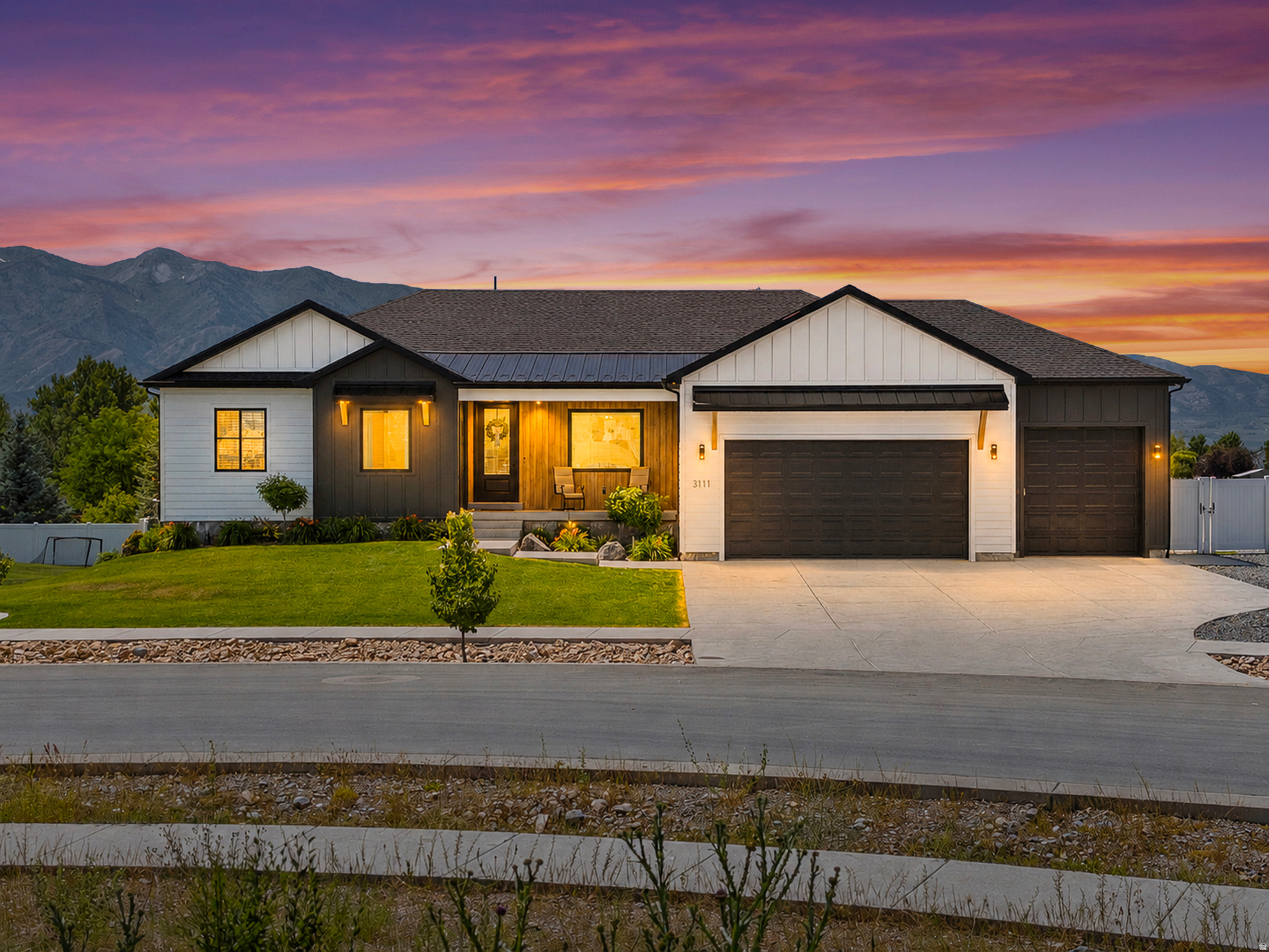 This home truly has it all! Thoughtfully designed with quality upgrades throughout. The open-concept floor plan features a stunning kitchen that flows seamlessly into the inviting living room, complete with a cozy fireplace and large windows that fill the home with natural light. The master suite features a spacious walk-in shower, a separate soaking tub, and a large walk in closet. Downstairs, the walkout basement is packed with amenities, including a dedicated theater room with theater seating, an exercise room, and an adorable village of children's playhouses that sparks imagination and fun. Step outside to enjoy the large backyard with a dedicated garden area and a cozy outdoor fireplace-perfect for gathering with family and friends. The oversized deep 3-car garage offers ample storage and can be heated for year-round comfort. Beyond the features you can see, this home is loaded with high-end upgrades, insulation upgrades, a tankless water heater with a recirculation loop for near-instant hot water, and countless thoughtful details designed to enhance efficiency, comfort, and everyday living. This is a home that must be experienced in person to truly appreciate all it has to offer!