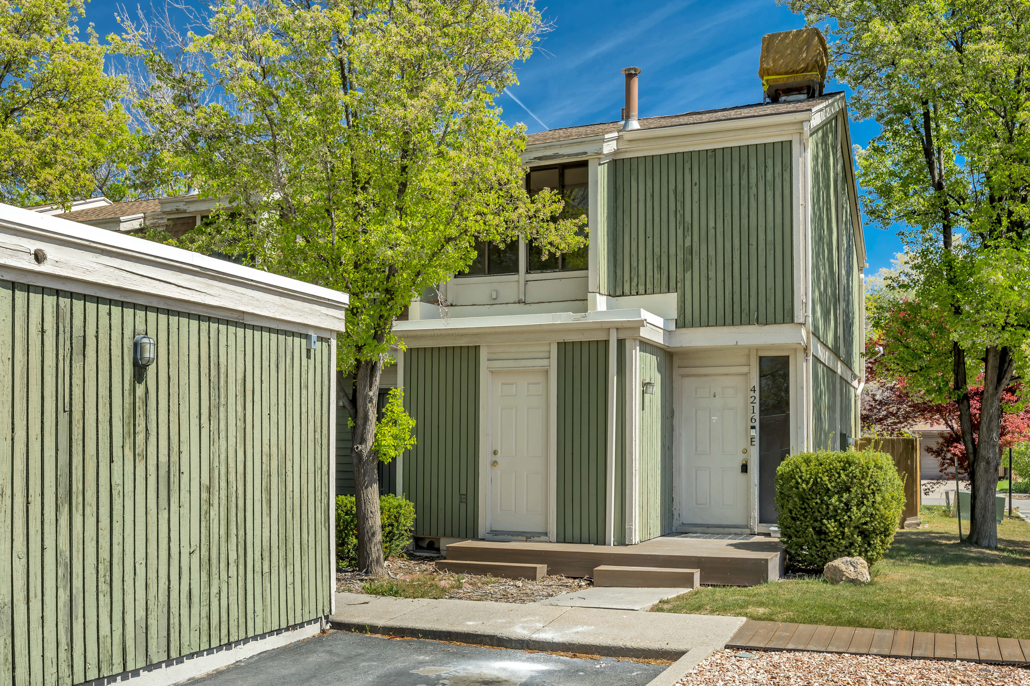 **Price Improvement**  Cute, cozy, and perfectly located near freeways and shopping! This 2-bedroom townhome features updated flooring and fresh paint, making it feel clean, bright, and move-in ready. Step outside to an amazing deck-perfect for relaxing or entertaining-and enjoy the added convenience of a carport and extra storage in the crawlspace. This one has all the right touches... you won't want to miss it