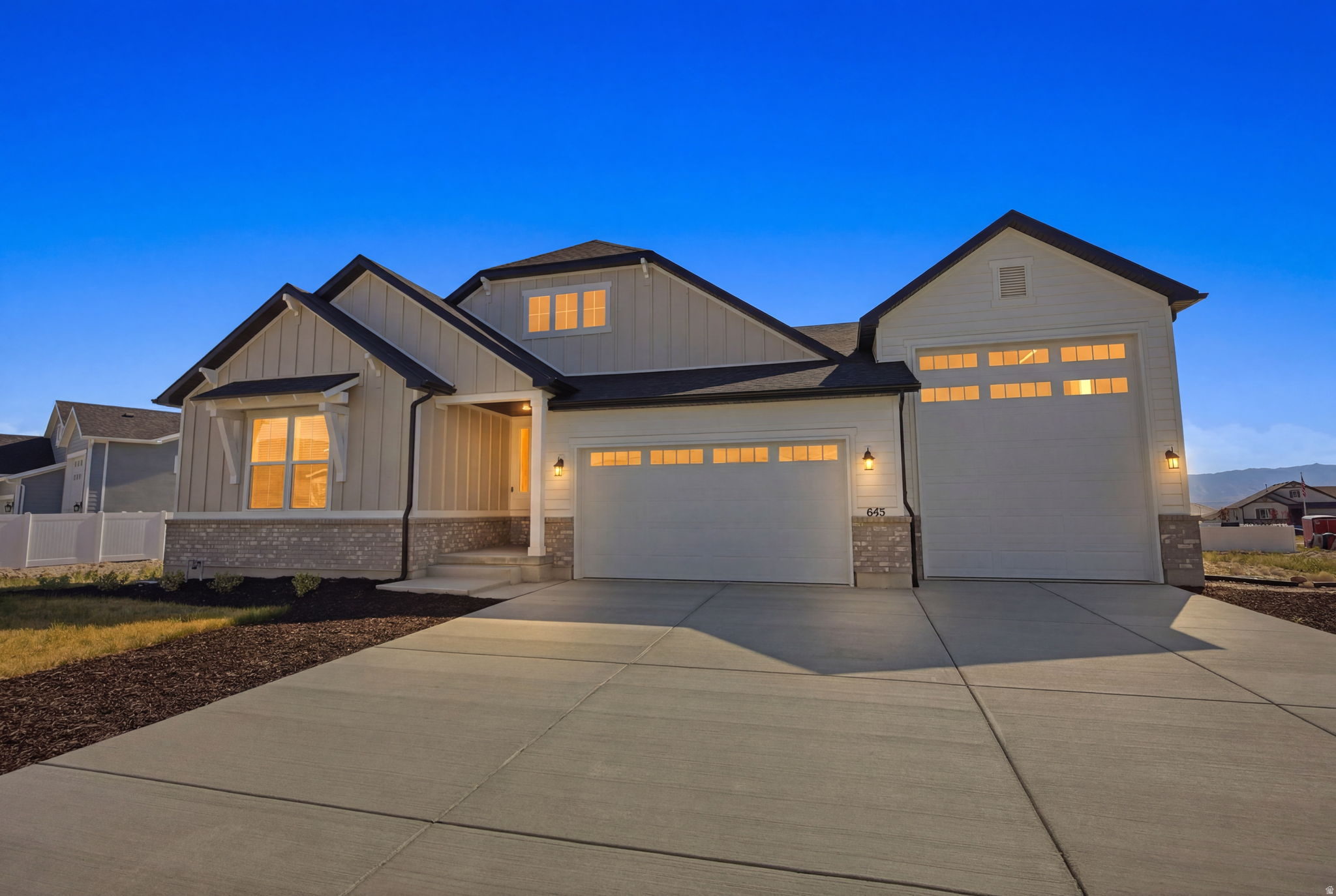 Purchased new in December 2025, this nearly-new Harris floor plan offers the perfect opportunity to enjoy the benefits of a move-in ready home without the wait, uncertainty, and additional expenses often associated with new construction. The seller purchased this home as his dream home and has loved living here, but is relocating to be closer to family, creating a rare opportunity for a new owner to enjoy this exceptional property.  Since purchasing, the seller has invested in a premium water softener system, professionally installed radon mitigation system, window blinds throughout the home, and newly purchased refrigerator, washer, and dryer, adding comfort, convenience, and thousands of dollars in added value.  From the charming covered front porch and impressive 8-foot front door to the soaring 9-foot ceilings and spacious open-concept design, every detail of this home was thoughtfully crafted for comfortable living and effortless entertaining. The flexible formal dining room can easily serve as a home office, sitting room, playroom, or additional gathering space to fit your lifestyle.  The heart of the home is the expansive great room featuring a beautiful fireplace and seamless flow into the gourmet kitchen. Designed to impress, the kitchen offers a massive walk-in pantry, oversized center island, abundant cabinetry, and a bright dining nook perfect for everyday living and hosting family and friends.  The luxurious primary suite provides a private retreat with a spa-inspired bath and generous walk-in closet. Additional bedrooms and living spaces offer flexibility and comfort for family members and guests alike.  Step outside to the covered patio, ideal for relaxing evenings, outdoor dining, and entertaining. The impressive RV garage, along with the spacious 2-car garage, provides exceptional storage and room for vehicles, recreational equipment, hobbies, and more.  Why wait months for new construction and then spend thousands more on upgrades, appliances, and finishing touches? This home already includes valuable improvements such as a water softener system, radon mitigation system, window blinds throughout, and newly purchased refrigerator, washer, and dryer. An exceptional opportunity to own a highly upgraded, move-in ready home without the delays and added costs of building new.  Buyer to verify all information, including square footage and taxes.