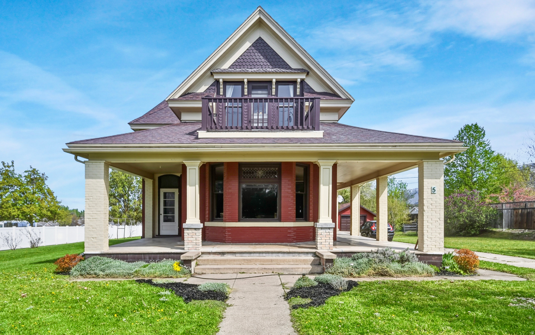 Step into timeless elegance with this beautifully Restored 1899 Providence home where historic character meets modern comfort. Situated on a generous (.77 ACRE) Lot with a large Wraparound front porch, producing Orchard & Garden as well as 2 Water SHARES included. Inside, you're greeted by 10-foot ceilings on the main level, 9-foot ceilings upstairs, original refinished wood floors, and three stunning bay windows accented with stained glass. Completely renovated, the kitchen offers ceiling-height cabinetry, stainless steel appliances, and quartz countertops. The inviting library features built-in bookshelves, a Cast Stone fireplace, and original pocket doors. The upstairs bathroom is a true showpiece, featuring beautiful imported Lincrusta and tile from England, paired with a classic clawfoot tub. MAIN-LEVEL LIVING includes a bedroom with walk-in closet & attached ensuite bathroom. A rare opportunity to own a truly one-of-a-kind home. Buyer to verify all information.