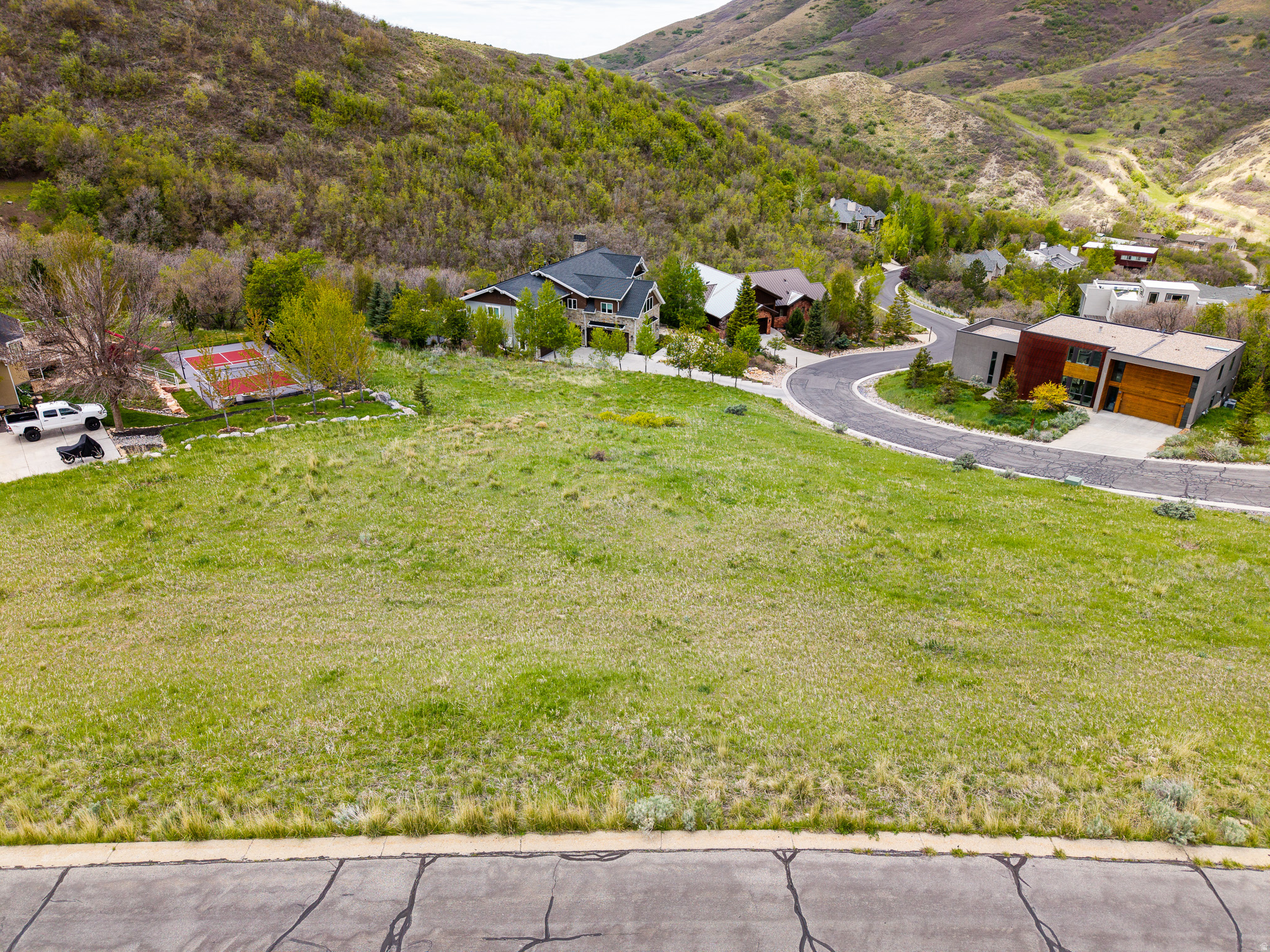 Discover the opportunity to build your dream home in one of Emigration Canyon's most desirable gated communities-just minutes from the heart of Salt Lake City. Perfectly positioned only 5 minutes from the University of Utah and Primary Children's Hospital, this premier homesite offers an unmatched combination of privacy, accessibility, and natural beauty. Located just 15 minutes from downtown Salt Lake City, this lot provides the ideal balance of peaceful canyon living with immediate access to world-class dining, entertainment, healthcare, and outdoor recreation. Compared to many surrounding luxury areas that come with significantly higher price tags and longer commutes, this property delivers exceptional value without sacrificing convenience or lifestyle. The lot features an ideal grade for a walkout basement design, maximizing both functionality and scenic views from your future patio or outdoor living space. With minimal excavation and retaining required, the property is truly turnkey and ready for construction. Surrounded by stunning custom luxury homes, the neighborhood offers strong value support and a prestigious setting for your future estate. Enjoy quick access to Park City via a scenic drive through the canyon, along with countless nearby hiking, biking, skiing, and outdoor recreation opportunities-all within minutes of your doorstep. Bring your own builder, or take advantage of available custom home plans and build options to create a residence tailored to your vision. The adjacent lot is also available for those seeking additional space, privacy, or the opportunity to expand into a larger estate property.