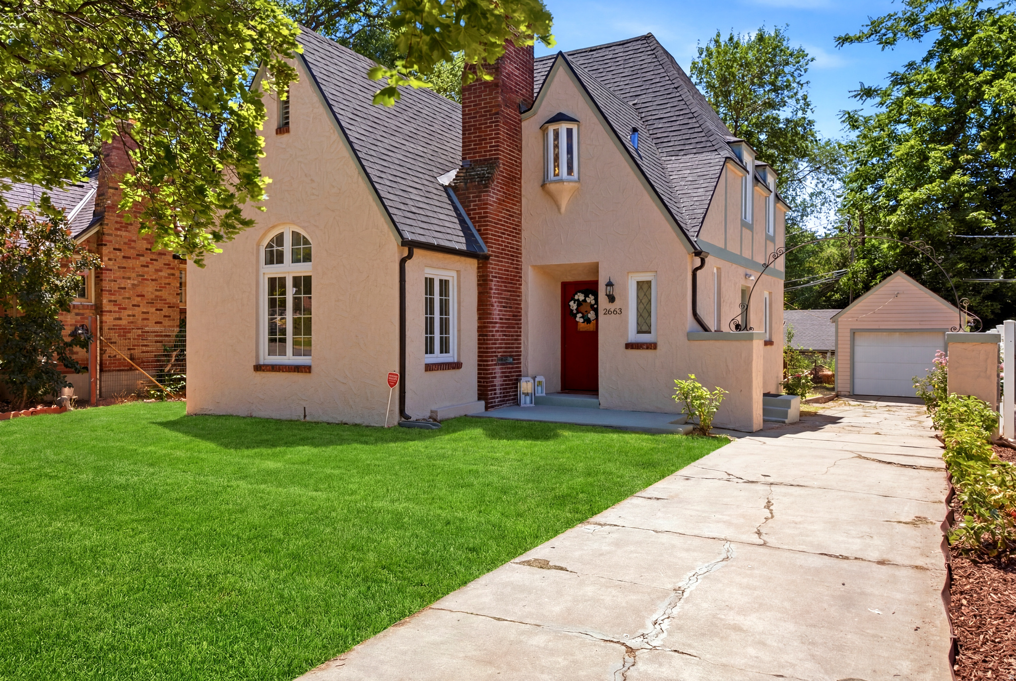 Rare opportunity to own this most unique1920's English Tudor Revival home located in Ogden's newest Marilyn Drive Historic District. Designed by the renowned architect Art Shreeve, it showcases timeless architecture with tons of character and charm. It's iconic silhouette is defined by its steeply pitched gabled roofline and prominent brick chimney. The stunning primary suite is the home's most recent addition, blending modern luxury with historic elegance. Enjoy a spa-inspired retreat featuring a grand walk-in steam shower, heated towel rack, and smart toilet. Additional highlights include, an updated kitchen, hardwood floors, exposed brick, updated casement windows, and large bedrooms with versatile den-style space to work at home. While the photos provide a glimpse of it's grander, it's even more impressive seen in person - schedule your private tour today and experience this historic treasure for yourself.