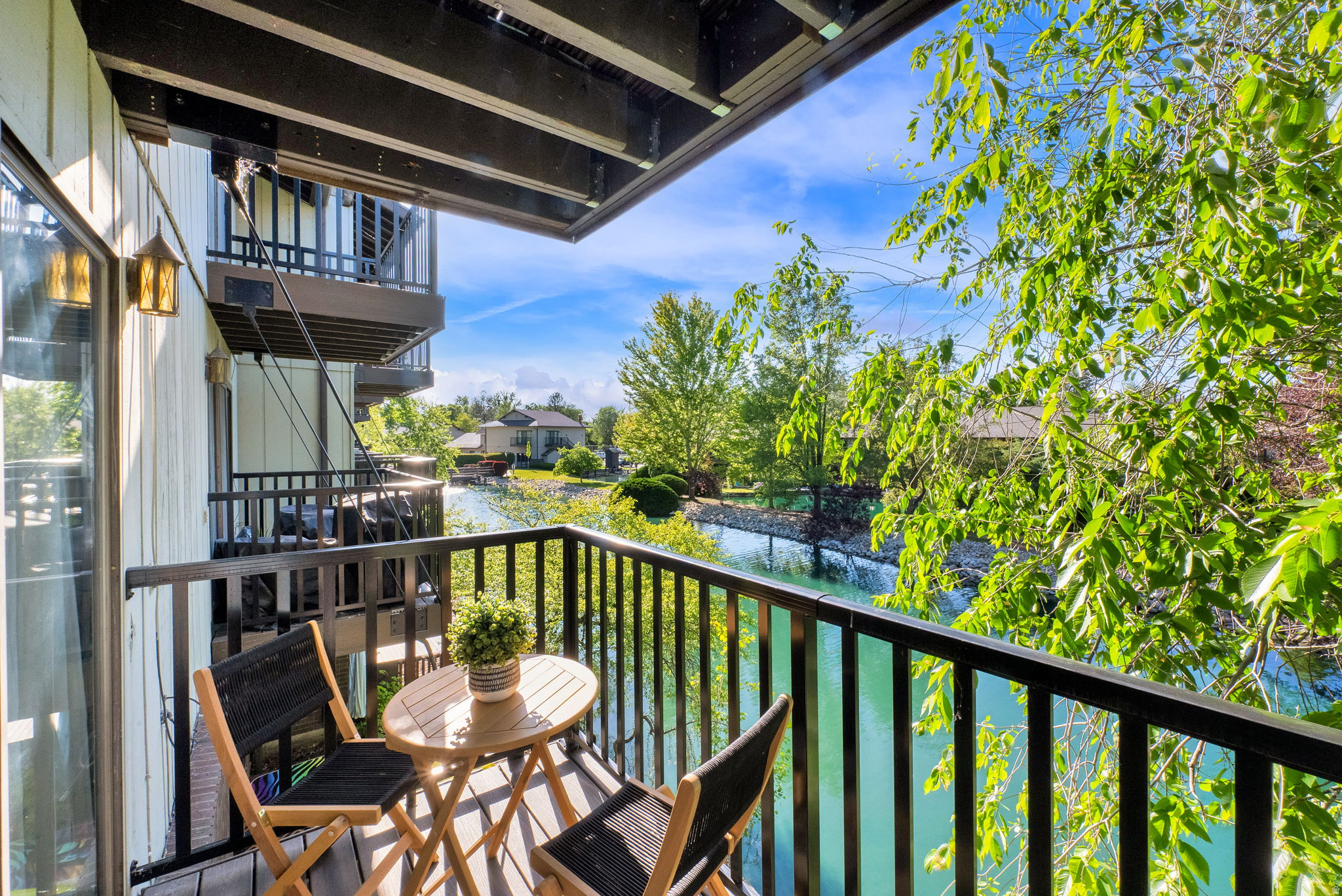 Tucked away in the heart of East Millcreek, this townhome-style condo feels like a peaceful retreat. Spacious main living area with a cozy gas fireplace and large sliding doors leading to the balcony overlooking the water. The eat-in kitchen is fresh and stylish with white cabinetry, quartz countertops, & stainless-steel appliances. Neutral paint tones and laminate flooring create a clean modern feel throughout.  All three bathrooms have been updated. The large primary suite features double closets, a private bathroom, and its own balcony. Upstairs bedrooms are generously sized with ample closet space. All of the appliances are included (fridge, washer, & dryer!). 1 car garage with a dedicated parking space. Well maintained development: lush landscaping, ponds, and waterfowl. The community feels like a hidden gem with the following amenities- a swimming pool, clubhouse, spa, sauna, tennis courts, and RV parking. Even better-your HOA covers gas, water, sewer, exterior insurance, exterior maintenance, grounds maintenance, garbage, and snow removal. Centrally located- close to TRAX, bus routes, shopping, and eateries.