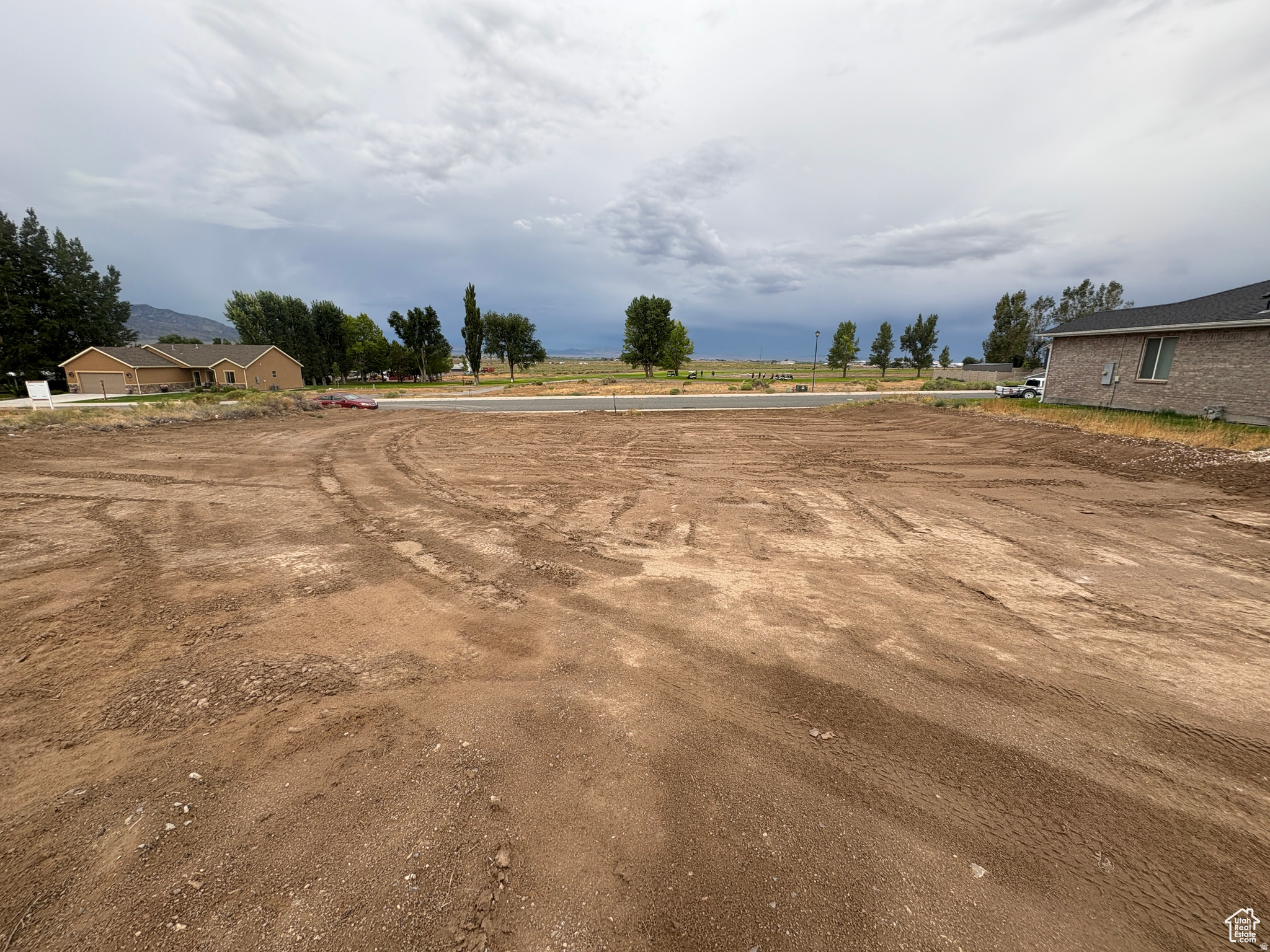 Across from the golf course, this stunning 3-bedroom, 2-bath single-level home offers open living, modern finishes, and gorgeous views. Build with the owner's attached house plan or bring your own builder to create your perfect home.