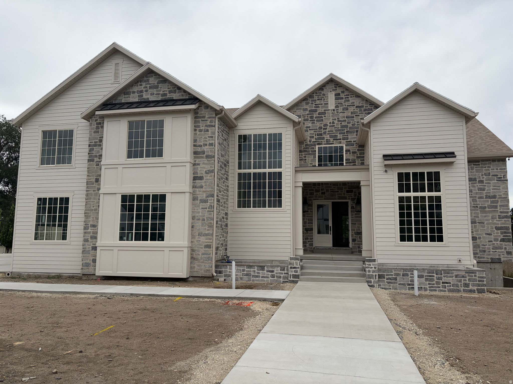 This home will be on display during the 2026 Salt Lake Valley Parade of Homes. The home features a chef's kitchen with butler's pantry, huge master retreat, swimming pool, sauna, indoor basketball court, theater, gym, golf simulator, video game room, and so much more.