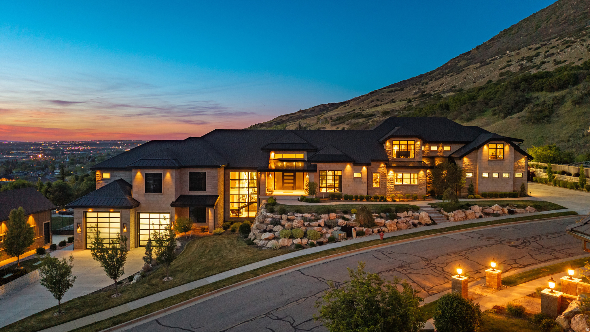 Where the Extraordinary Becomes Reality: This is not just a home, it's a sanctuary. A rare offering that defies expectations, this one-of-a-kind estate seamlessly blends unparalleled luxury with breathtaking panoramic views, stretching from Ben Lomond Peak across the Salt Lake Valley. Built to endure for generations, its full limestone exterior commands attention, setting the stage for what lies within.    A Home That Must Be Seen to Be Believed:  You truly can't have it all, unless you're here. From the moment you arrive, the estate captivates, drawing you into a world where every detail has been meticulously crafted. At its heart, a stunning heated saltwater pool and spa, encased in limestone, serves as the architectural centerpiece, inviting you to indulge in the beauty of your surroundings.  Designed for Living, and Entertaining: The gourmet kitchen is a masterpiece of functionality and style, featuring dual islands, a butler's pantry, and sweeping views of the mountains, valley, and pool. A custom marble dining table anchors the space, flowing effortlessly into a grand family room designed for both intimate gatherings and lavish entertaining.  Retreats for Every Moment:  The primary suite is a sanctuary of luxury, offering expansive views and separate his-and-hers bathrooms. Each of the eight bedrooms includes en-suite bathrooms and walk-in closets, ensuring comfort and privacy. A versatile interior ADU provides flexibility for multigenerational living or guests, complete with a full kitchen, family room, and those same stunning views. Entertainment and Wellness, Redefined: The lower level is an entertainer's paradise, featuring a state-of-the-art theater, gaming area, wet bar, and golf simulator. For wellness, a private gym, sauna, steam room, and cold plunge create a resort-like experience at home. Outside, a sprawling grassy area is complemented by private pickleball and basketball courts.  Space for Every Passion:  A heated six-car garage and a secondary garage for boats and RVs offer ample space for collectors and adventurers. Nestled in a serene, private setting, the property immerses you in nature's tranquility, with the soothing sounds of the river below.  Luxury in Every Detail:  Experience radiant heating throughout the home and exterior, a pebble ice machine, heated pool decks, a built-in saltwater aquarium, and whole-home reverse osmosis water. This estate is more than a residence, it's a legacy, a sanctuary, and an experience that transcends the ordinary. To truly appreciate its grandeur, it must be seen.  check out the video tour https://www.youtube.com/watch?v=8Osf7CkHBao