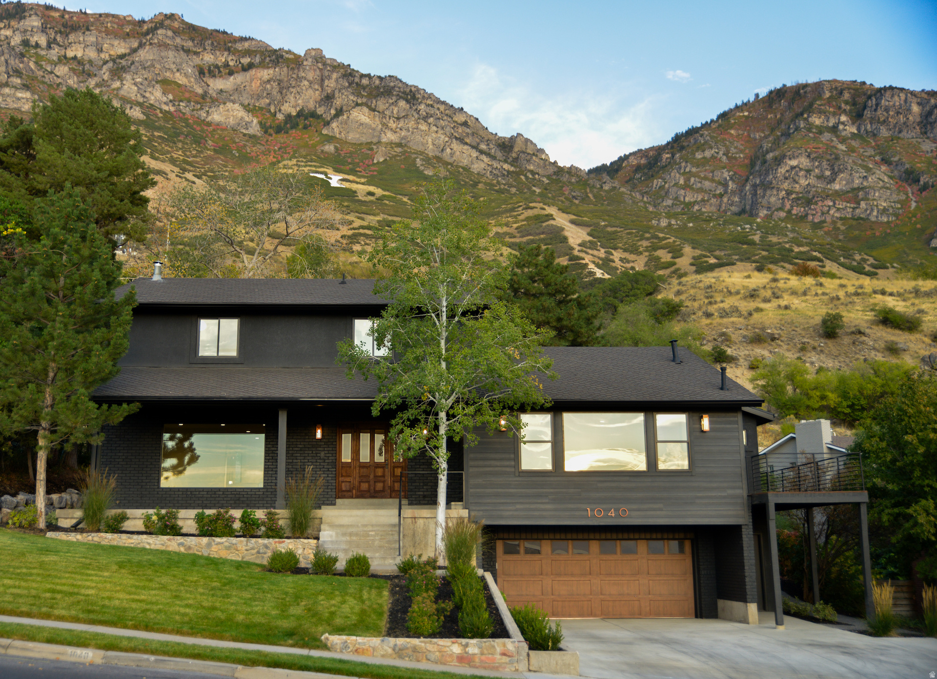 Beautifully remodeled East bench Provo home. Highly desired unobstructed 180 degree views facing west across Utah Lake, and unobstructed views facing east up Y Mount, with gentle sloped lot and oversized beautiful backyard. Close to downtown Provo, BYU, newly built Wasatch Elementary, and Lavell Edwards Stadium. A MUST SEE. All permits pulled and inspected by Provo City. Enjoy the open and redesigned kitchen, dining, family rooms, master suite, second floor sitting area and bedrooms, and all the lines and flow of the home's layout. Full remodel, including relayout of entire main floor, master, and second floor, all new hardwood flooring, wrap around redwood deck, all new landscaping and driveway, floating staircase, Pella windows, etc. Please note the quality and selection of all plumbing and lighting fixtures, appliances, flooring, and hardware. Kitchen includes custom cabinetry, quartz countertops, KitchenAid appliances with 36" dual fuel range, butler's pantry, and side-by-side refrigerator and freezer. Additional features include 256 sq ft of cold storage, tankless water heater, laundry on each floor, 200 amp electrical service upgrade, outdoor lighting, fully updated plumbing and electrical, and cat6 Ethernet wiring. Please drive the neighborhood and see how wonderful the surrounding homes and community are. Square footage figures are provided as a courtesy estimate only, obtained from county records. Buyers are advised to obtain their own independent measurement. Owner/agent.