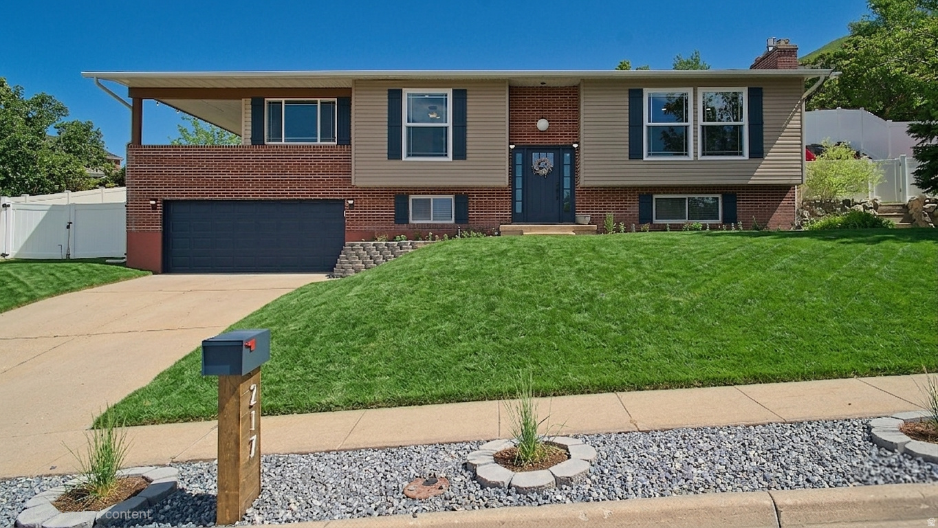 WOW!! Amazing Home in Wonderful East Centerville Neighborhood with VIEWS of the Valley and Mountains! You'll LOVE the Large Upgraded Kitchen with Quartz tops, Farm Sink and Stainless Steel Appliances! Lots of Countertop Space and Storage Cabinets, Pantry, Delightful Tile Backsplash and Desk Area! All Appliances are Included! Spacious Dining Area and Family Room! Stylish Living Room with Custom Paint and Board & Batton Walls! Beautiful Fireplace, NEW WINDOWS, Custom Up and Down Shades! Primary Bedroom with Double Closets and Storage Closet! Primary Ensuite Bathroom Boasts Granite Vanity, Lots of Storage Cabinets and Linen Closet! Large Covered Patio has VIEWS and is the Perfect Setting for your Next Family Gathering! Fabulous Backyard with Open Patio is Perfect for Entertaining with the Funest Playhouse in the Neighborhood, Hanging Hammocks, and In-Ground Trampoline with BBall Standard on Large Flat Area that has AMAZING SUNSET VIEWS and would be the perfect spot for a Family Firepit! NEW WINDOWS, NEW SHUTTERS, 4-Year Old Roof! 4 Bedrooms, 3 Upgraded Baths, Basement Family Room, Playroom, GREAT VIEWS, Fabulous Backyard on a Quiet Street...YOU ARE HOME!!!  Call for your Personal Showing! Will Sell Fast at this Great Price! Buyer to verify all info.