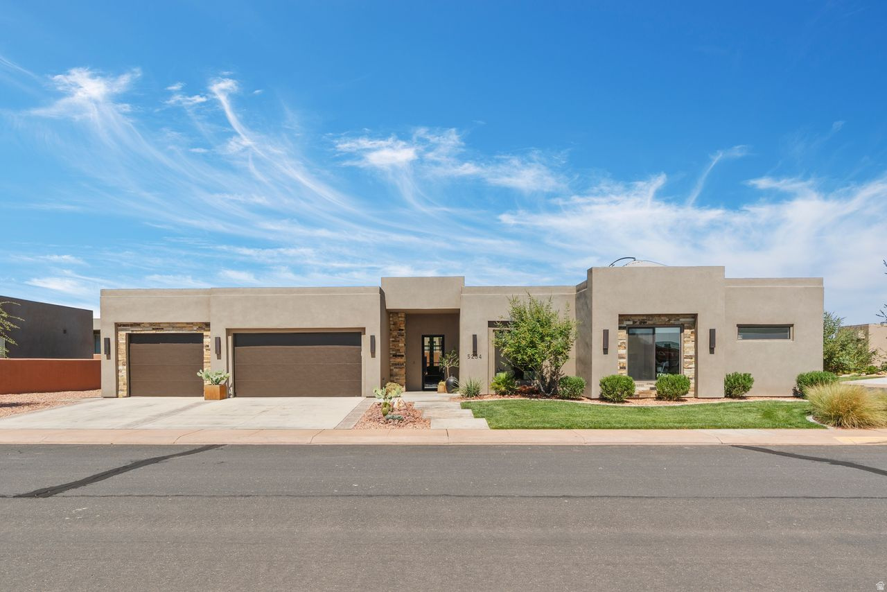 Sand Hollow Escape with Rooftop Views minutes from Zion. Discover this spacious 4-bedroom, 4-bathroom home, perfectly situated in the desirable Sand Hollow Resort community. Each bedroom includes its own en suite bath and walk-in closet, offering privacy and comfort for all. Designed with care by a professional interior designer, this home is filled with upgrades throughout: brand-new carpet, elegant tile flooring, custom beams in the living room, upgraded lighting, ceiling fans in every bedroom, and high-end appliances. The striking wrought iron and glass front door creates a warm welcome into this thoughtfully curated home. Enjoy breathtaking views from the rooftop patio-perfect for stargazing and evening gatherings. Additional highlights include a spacious 3-car garage with EV charging, abundant storage, hot tub, three-zone air conditioning and humidifier for year-round comfort. Living at Sand Hollow Resort means access to world-class amenities: three pools, hot tubs, pickleball courts, fitness center, clubhouse, and The Grille restaurant. HOA benefits include full yard care (front and back) and exterior maintenance, offering a "lock-and-leave" lifestyle with all the comforts of a private home. Homeowners also enjoy discounted golf rates, plus special pricing on ATV, boat, and watercraft rentals at nearby Sand Hollow Reservoir. With Zion National Park just 30 minutes away, Zion Canyon Hot Springs only 20 minutes, and Bryce Canyon within easy reach, this location offers endless opportunities for adventure. All of this, right next door to the dunes and 5 minutes from the lake, makes this home a perfect retreat for both relaxation and recreation. Square footage figures are provided as a courtesy estimate only and were obtained from County. Buyer is advised to obtain an independent measurement.