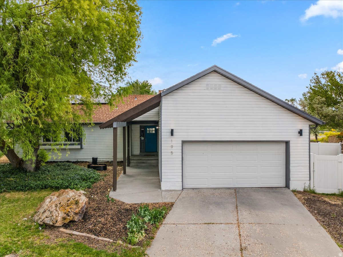 BUILT ON THE GOLF COURSE AND ONLY 30 MINUTES FROM SALT LAKE! Bright and beautifully designed, this 4-bedroom, 3-bathroom custom home offers the perfect blend of comfort, style, and scenic golf course living. Filled with natural light, the open floor plan creates a seamless flow between the living, dining, and kitchen areas-ideal for both everyday living and entertaining. The spacious living room features a cozy fireplace, while the modern kitchen is appointed with elegant quartz countertops and ample workspace. Enjoy peaceful golf course views from two private decks, perfect for morning coffee or evening gatherings. Energy-efficient solar panels add modern convenience and long-term savings to this exceptional home.   Square footage figures are provided as a courtesy estimate only and were obtained from County Records.  Buyer is advised to obtain an independent measurement.