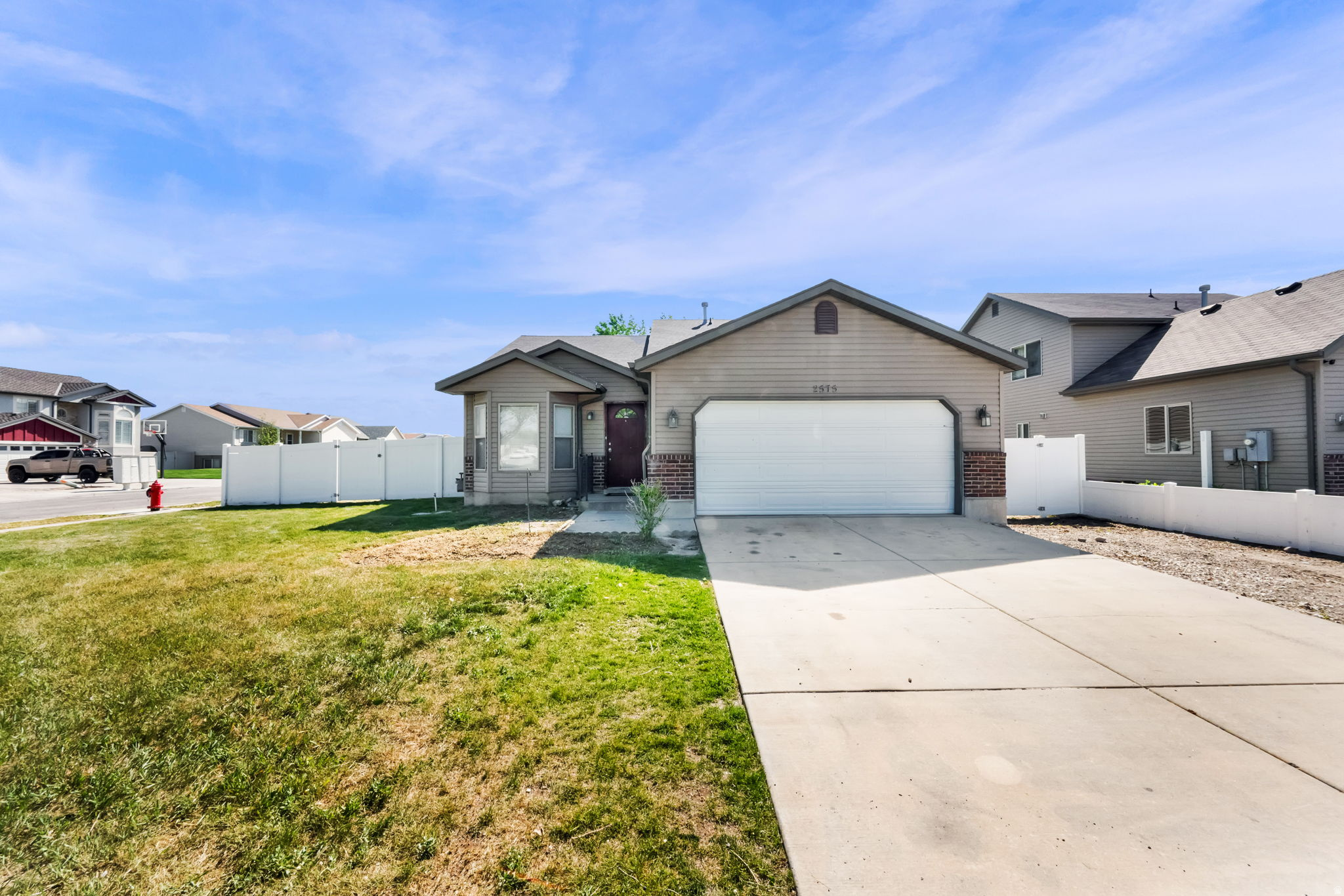 This single family home in Magna offers a functional and attractive layout across three finished levels. The main floor features an open floor plan with large windows that fill the space with natural light. The kitchen includes all appliances, vaulted ceilings, and recessed lighting. Upstairs, the primary bedroom includes a private ensuite, accompanied by two additional bedrooms and a full bathroom. The fully finished basement provides a second family room, an additional bedroom, and a half bathroom. The fully fenced backyard features mature trees and a large concrete patio, making it a great space for outdoor entertaining or relaxing summer evenings. This property is conveniently located near shopping, entertainment, dining, and is easy access to I15. Tenants are responsible for electricity, gas, water, sewer, garbage, and renters insurance. Tenants are responsible for landscaping and snow removal. Pets are accepted on a case by case basis. If accepted, $75 per pet/monthly plus a $750 per pet deposit that is fully refundable. For additional requirements, please visit: https://actionteamutah.com/requirements-for-renters.