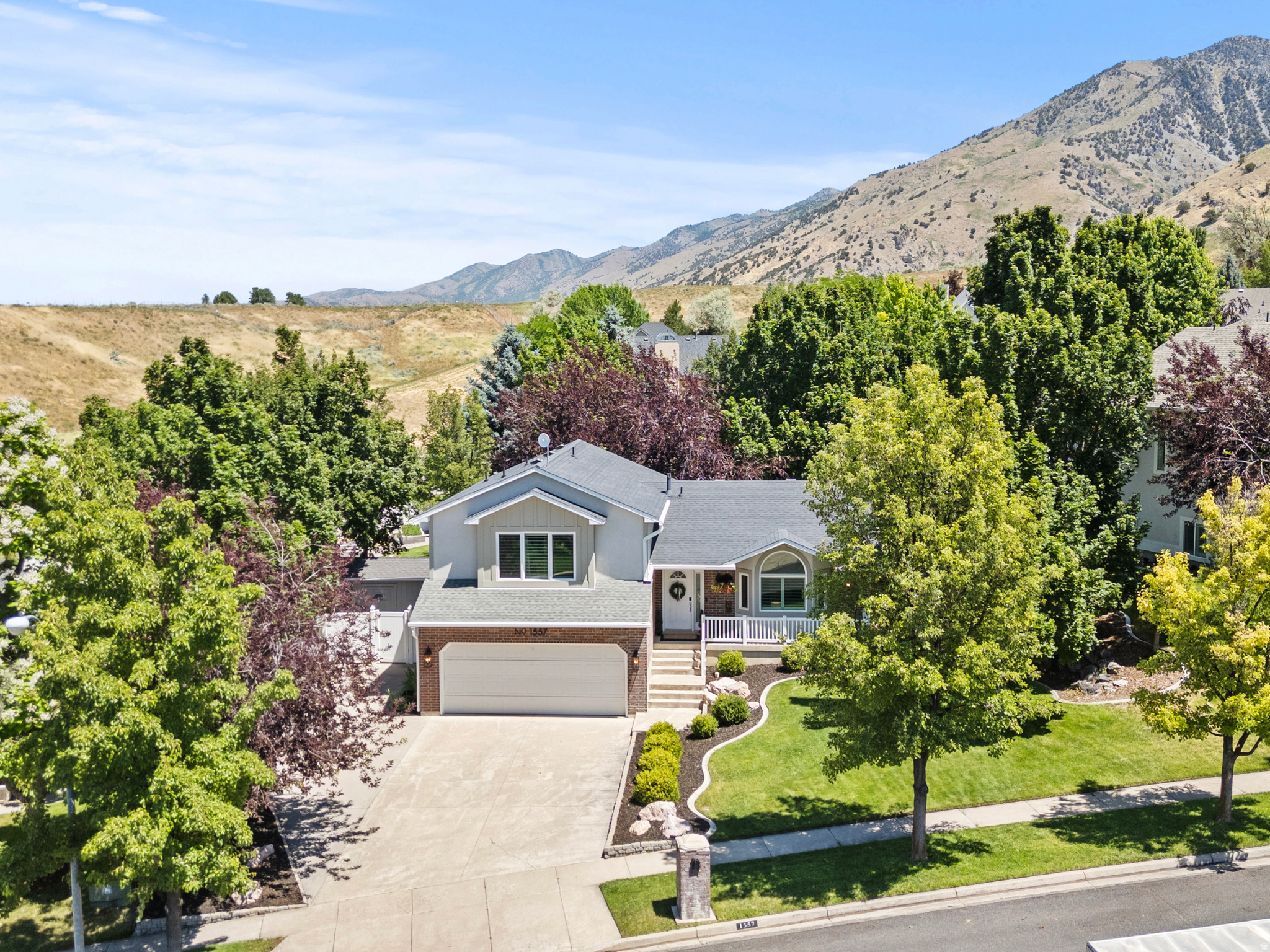 Nestled in one of the area's most desirable neighborhoods, this truly one-of-a-kind home combines exceptional updates with a setting that is nearly impossible to find. Thoughtfully and tastefully renovated throughout, every detail reflects the owner's remarkable eye for design, creating a home that feels both timeless and welcoming.  Situated on a large south-facing lot surrounded by an abundance of mature trees, the property offers a level of privacy rarely found in our market. The established landscaping, fruit trees, garden boxes, fully fenced yard, and lush canopy of trees create your own private retreat while still being conveniently located near everything you need.  Inside, you'll find five spacious bedrooms and three generous family rooms, providing plenty of space to gather, entertain, or simply spread out and enjoy everyday living. Two inviting decks offer the perfect place to relax, unwind, and enjoy the beauty and tranquility of the backyard.  Impeccably maintained and exceptionally clean, this home stands apart from the moment you arrive. Homes offering this combination of tasteful updates, a highly sought-after neighborhood, mature landscaping, privacy, and a large lot are incredibly rare. This is a property that must be experienced in person to fully appreciate all it has to offer. Buyer to verify all information.