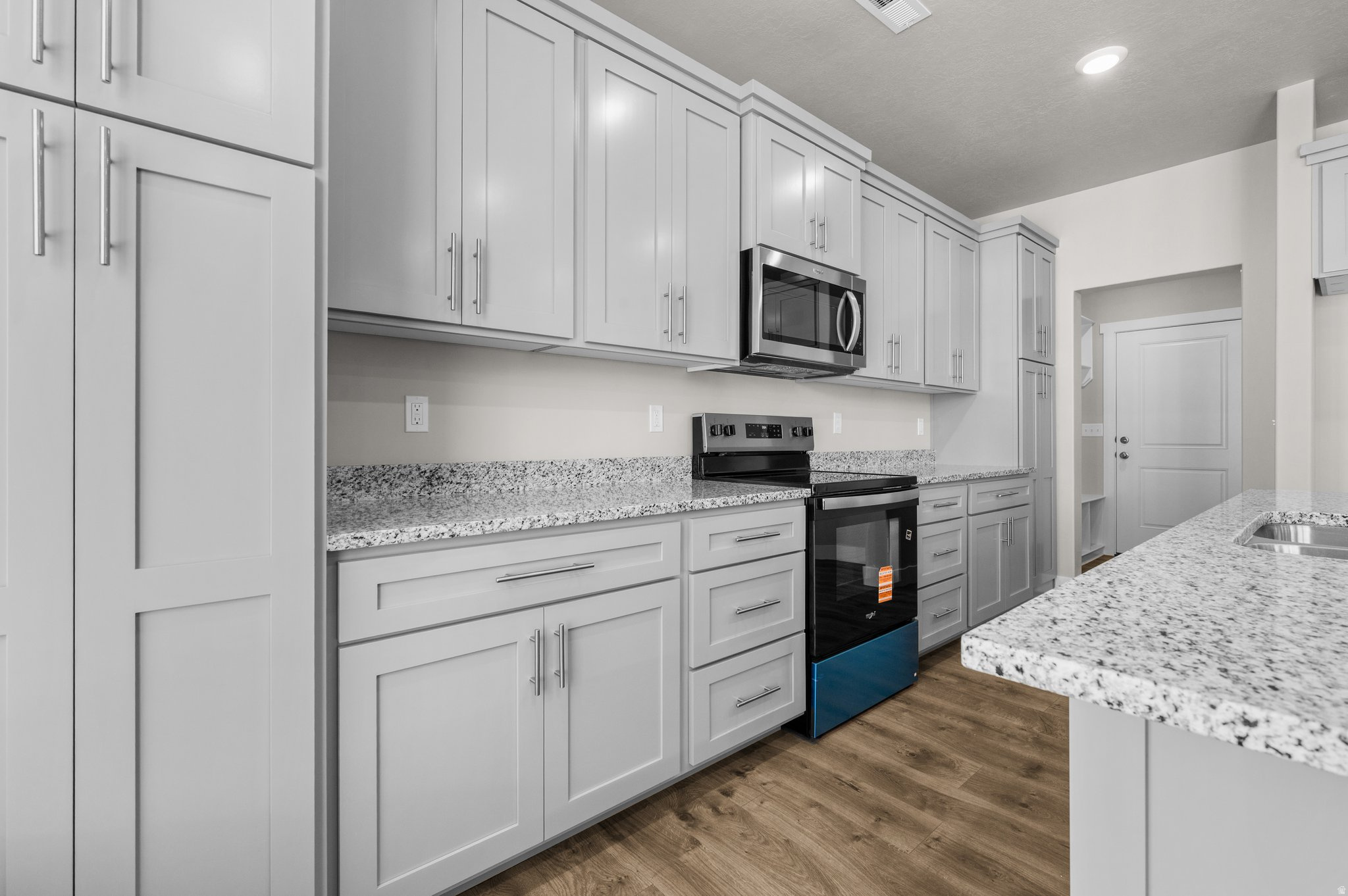 Welcome to Midland Square Townhomes in Roy! These BRAND-NEW 3-bedroom, 2.5 bathroom, townhomes feature 9' ceilings on the main level, granite or quartz countertops, soft-close cabinets, a spacious walk-in pantry with an outlet for appliances, ceiling fan in the living room, abundant kitchen storage and counter work space, LPV throughout main floor, under the stairs storage along with two linen closets upstairs, mudroom area, and 2-car garages. Partially fenced backyard spaces provide added privacy and functionality. The generously sized primary bedrooms include a walk-in closet, ceiling fan, with select homes offering double vanities and large showers, while others feature single vanities with separate tub/shower combinations. Choose from floor plans with unfinished basements for future growth OR options without basements to fit your needs. Enjoy convenient access to shopping, dining, schools, parks, and the FrontRunner. Midland Square offers comfortable, low-maintenance living in a welcoming, community-focused neighborhood.