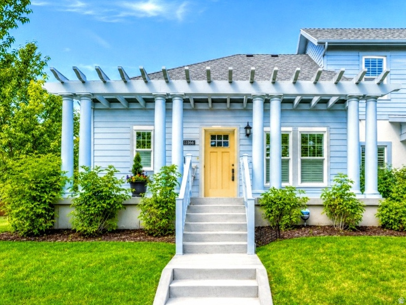Nestled in the heart of Daybreak's premier neighborhoods, this beautifully maintained, 1 level, Row-end residence delivers easy, low-maintenance living with an abundance of natural sunlight and added seclusion. Perfectly positioned beside a large peaceful green space, residents can relax among the beautifully, maintained scenery right outside their large front porch or cozy side patio areas. The home is conveniently located just moments from the community clubhouse, resort-style pool, tennis & pickleball court, and relaxing spa, while also offering quick access to Trax, the local library, and the Ballpark district. ALL appliances INCLUDED!  Inside you'll discover an airy designed layout, thoughtfully designed with stylish upgrades, accessibility-friendly features, and a welcoming atmosphere that's ready for immediate enjoyment. This exceptional property combines comfort, location, and lifestyle in one of Daybreak's most desirable 55+ communities.  HOA confirmed they will allow under 55 with approval. Square footage figures are provided as a courtesy estimate only and were obtained from tax data.  Buyer is advised to obtain an independent measurement.