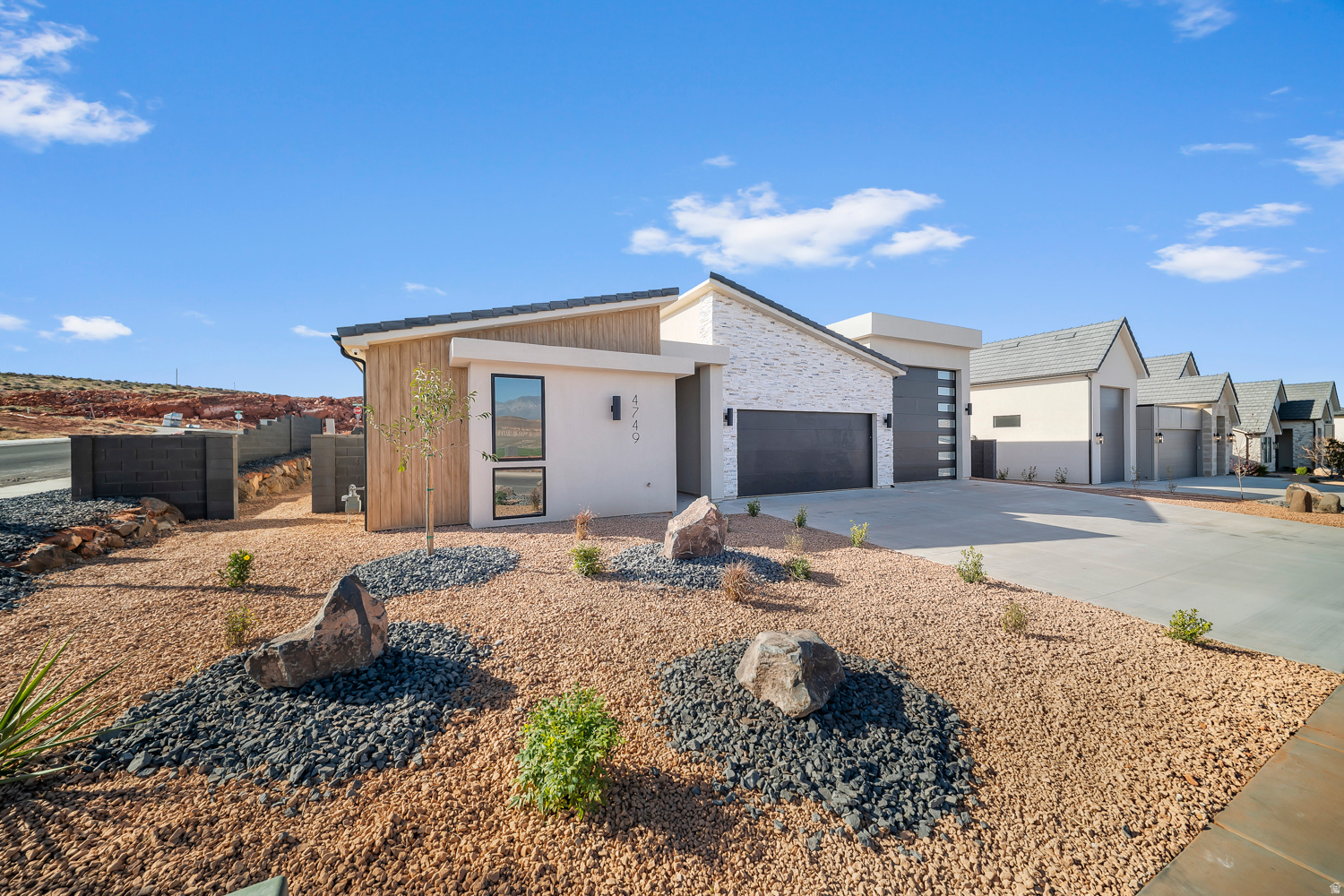 ~58' RV GARAGE SAND HOLLOW~  YOU WON'T WANT TO MISS THIS...360 Degree Landscaping Included! This single level Big Rock Homes home is in the sought-after Sand Hollow Village. One of the home's standout features is the massive 58-FOOT DEEP RV GARAGE. Inside, you'll find an open-concept layout with LUXURY FINISHES. REAR LANDSCAPING INCLUDING! 4 security cameras are wired through out the exterior of the home. - Ask about lender incentives! Just minutes from Sand Hollow Reservoir, Sand Hollow Golf Course, the sand dunes, and Zion National Park, you're surrounded by year-round adventure. Additional rear landscaping packages available. Contact listing agent for showings & Incentives!