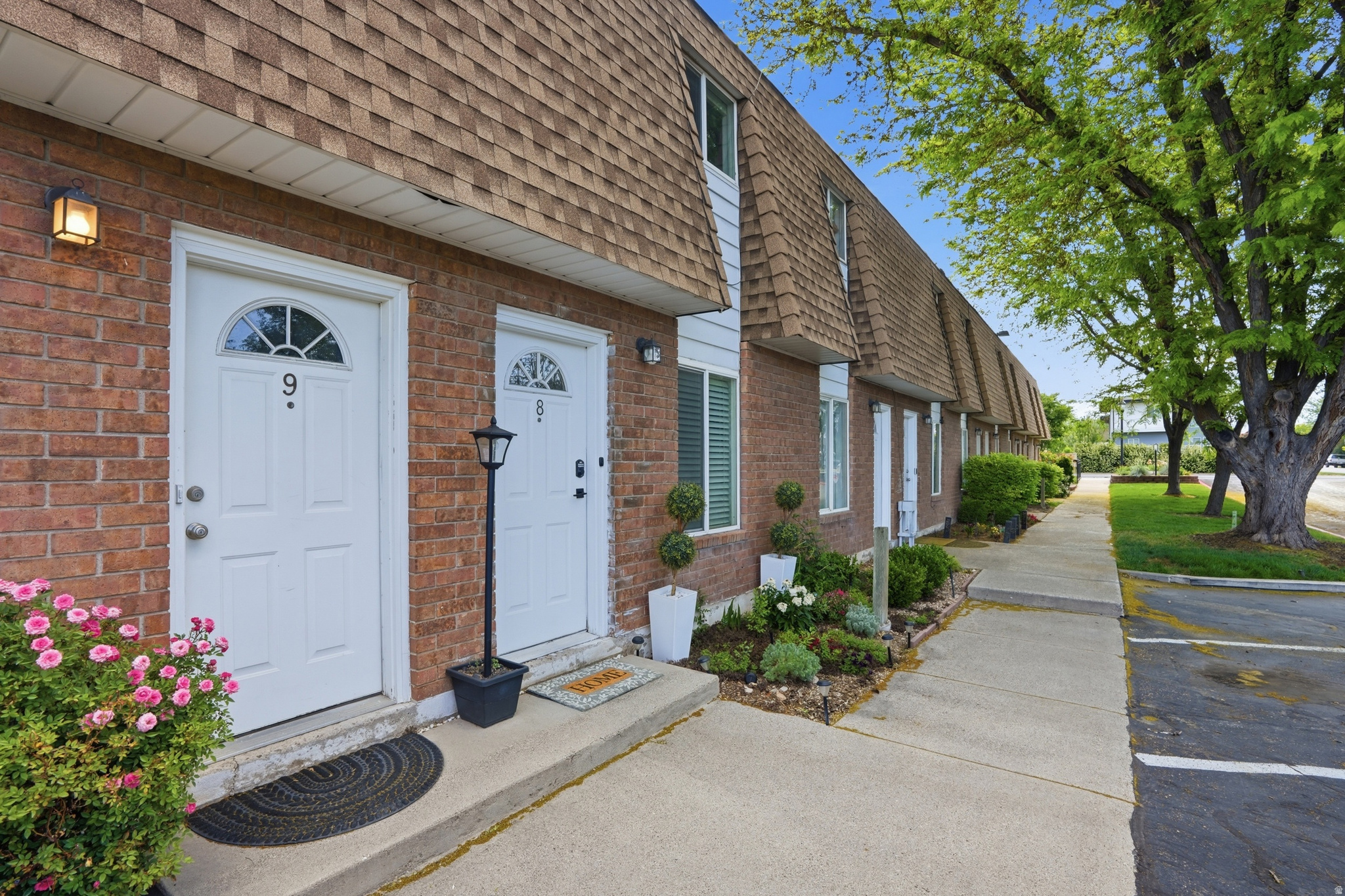This cozy and inviting townhome has all the vibes you've been looking for, complete with a private patio perfect for summer morning coffee or evening get-togethers, an open shelving kitchen, main floor laundry, and easy front door access that makes everyday living simple and comfortable.  Located walking distance to the local favorite Millcreek Gardens Nursery, as well as, stores & restaurants- you'll love being tucked into one of the most charming areas around!  Plus, the home includes 2 covered parking spaces and a bonus- long term rentals are allowed with HOA approval, giving flexibility for future investment potential!  Whether you're looking for your first home, downsizing, or wanting a low maintenance property in an amazing location, this one is it!     Square footage figures are provided as a courtesy estimate only and were obtained from county records .  Buyer is advised to obtain an independent measurement and to verify all.