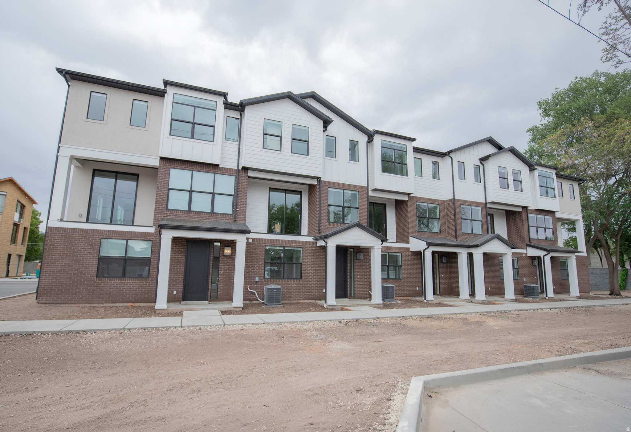 Welcome to theIVY by Cole West,  a thoughtfully designed new construction END UNIT townhome community in the heart of Millcreek. These modern homes offer a true move-in ready experience with custom-curated designer finishes, including quartz countertops, tile backsplash, stainless steel appliances, and roller window treatments, all included. Open-concept floorplans allow for tons of natural light, and attached garages create a seamless blend of style, function, and low maintenance living. Experience the ideal lock-and-leave lifestyle just minutes from Millcreek Commons, with easy access to scenic trails, Millcreek Canyon, and Big Cottonwood Canyon for year-round outdoor recreation. Conveniently located near Sugar House and Holladay with incredible Freeway access, theIVY offers the perfect balance of urban convenience and mountain lifestyle living. Unmatched location, and effortless convenience, welcome home to theIVY. Schedule a private tour today, this is the last end unit available in this community.  Home is under construction photos of a finished unit - same floorplan and finishes as shown just a different location within the community. Taxes have not yet been assessed