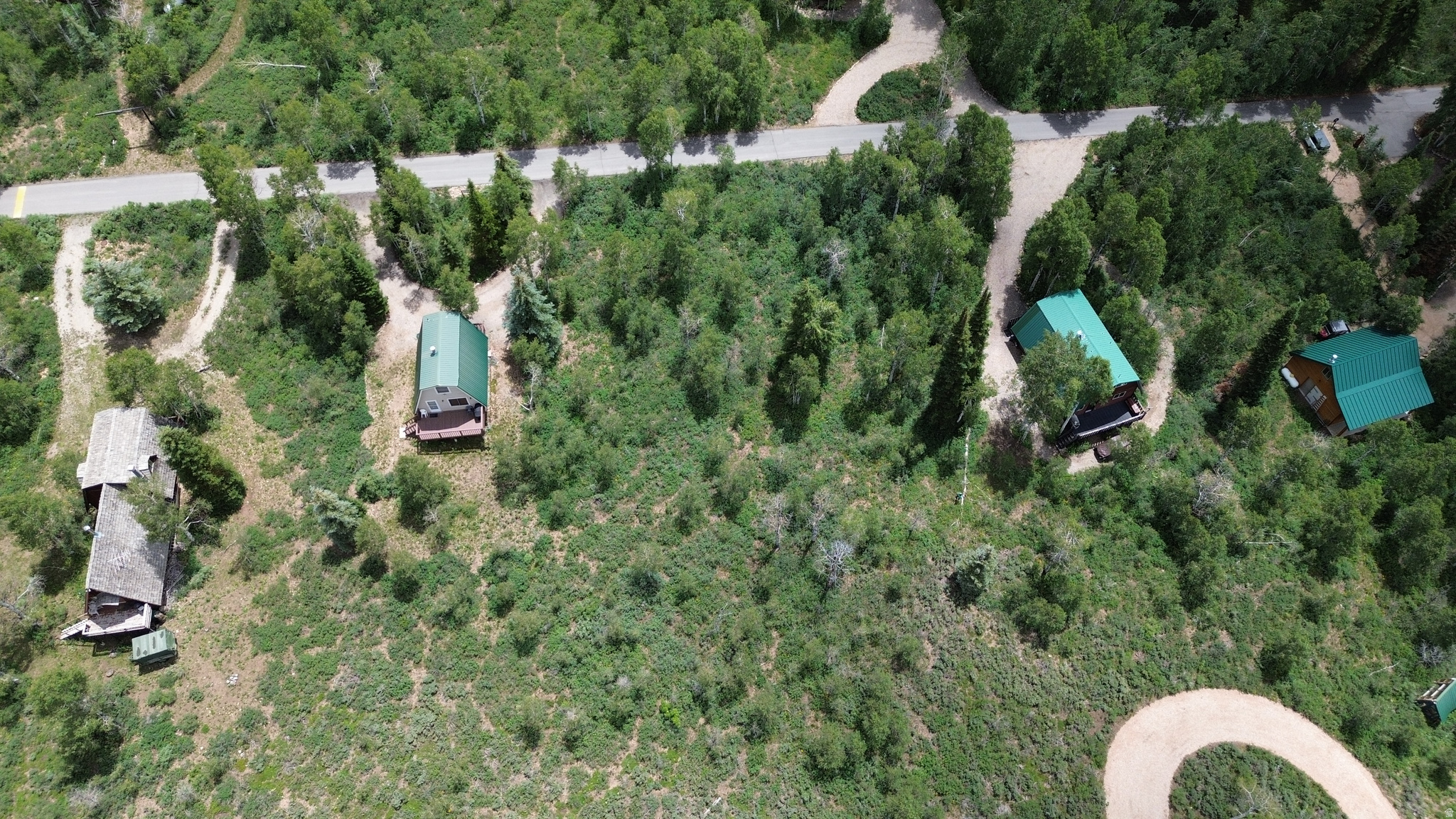 Surrounded by Aspens & Pines, this beautiful property offers the ideal setting to build your dream cabin with breathtaking north-facing views across Weber Canyon. The level terrain provides easy access and simplifies the building process, making it easier to bring your vision to life. Enjoy the peace, privacy, and natural beauty of Pine Mountain.