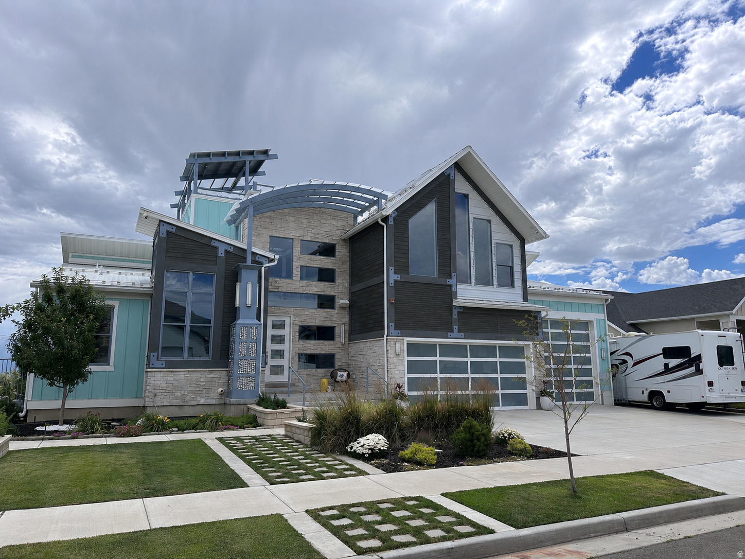 Make your move to Utah unforgettable. This custom-built 2022 luxury estate sits in Herriman's exclusive Range East community, just 25 minutes from Salt Lake City International Airport and minutes from the Wasatch Front-with world-class skiing, five national parks, and year-round outdoor recreation all within reach. Offering 8,479 square feet of thoughtfully designed living space with no expense spared, it's the perfect landing spot for buyers seeking more space, more privacy, and an extraordinary lifestyle. Soaring ceilings, a dramatic glass staircase, and walls of windows fill the home with natural light. The chef's kitchen features quartz countertops, double ovens, and an expansive great room designed for effortless entertaining. Upstairs, you'll find a luxurious primary suite, private office, loft, and dedicated exercise room, while smart-home automation, whole-house Bluetooth audio, and comprehensive interior and exterior security provide modern convenience throughout. The fully finished daylight basement with walkout access is designed for flexibility and entertainment. Enjoy a dedicated home theater with immersive surround sound, a rare indoor sports court perfect for year-round recreation, fitness training, basketball, pickleball, obstacle courses, or creative studio space, plus multiple finished rooms ideal for guests, multigenerational living, home offices, podcasting, media production, photography, e-commerce inventory, or other home-based businesses. Outside, resort-style living awaits. Spend summer days in the heated in-ground pool, relax in the adjacent hot tub, gather around the recessed fire pit, or rinse off in the outdoor shower. For an even more spectacular retreat, head to the private rooftop deck featuring a second hot tub and sweeping Wasatch Mountain views-the perfect place to enjoy unforgettable sunsets, entertain guests, or soak beneath Utah's star-filled skies. With a 4-car garage, dedicated RV parking, and parking for up to 12 vehicles, this one-of-a-kind estate offers the rare combination of luxury, versatility, and functionality. Recently repriced to $1.82 million, this exceptional home presents an outstanding opportunity to own one of Herriman's premier custom estates.