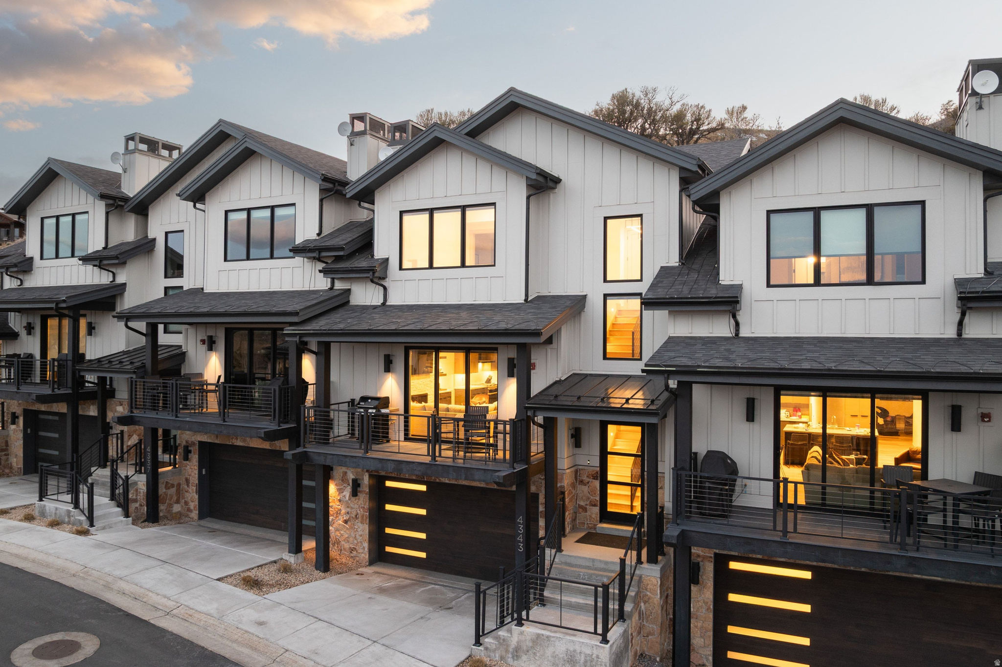 Welcome to Frostwood Village, one of Canyons Village's most sought-after addresses for buyers who want genuine ski convenience without compromise. The buyer for this home prioritizes scale, turnkey convenience, and easy ski access - without paying the Center Village premium to get it. This five-bedroom, six-bathroom townhome delivers an effortless ownership experience from the moment you arrive - fully furnished, move-in ready, and positioned just steps from the Frostwood Gondola and alongside the 10th fairway of the Canyons Golf Course. Completed in 2022, the residence showcases a warm mountain-modern interior with timber-frame construction, wide-plank wood flooring, high ceilings, and generous living spaces designed for both relaxed family gatherings and effortless entertaining. The gourmet kitchen, spa-inspired baths, and private hot tub round out a home that performs as well as it photographs. Two covered garage spaces, a programmable smart home system, and nightly rental approval make this an equally compelling investment. The Canyons Village Master Association shuttle connects owners to dining, retail, and resort amenities throughout the base area. Frostwood strikes the rare balance - intimate and residential in feel, yet directly woven into the resort fabric. Four seasons. Zero compromises. This is Park City ownership done right.