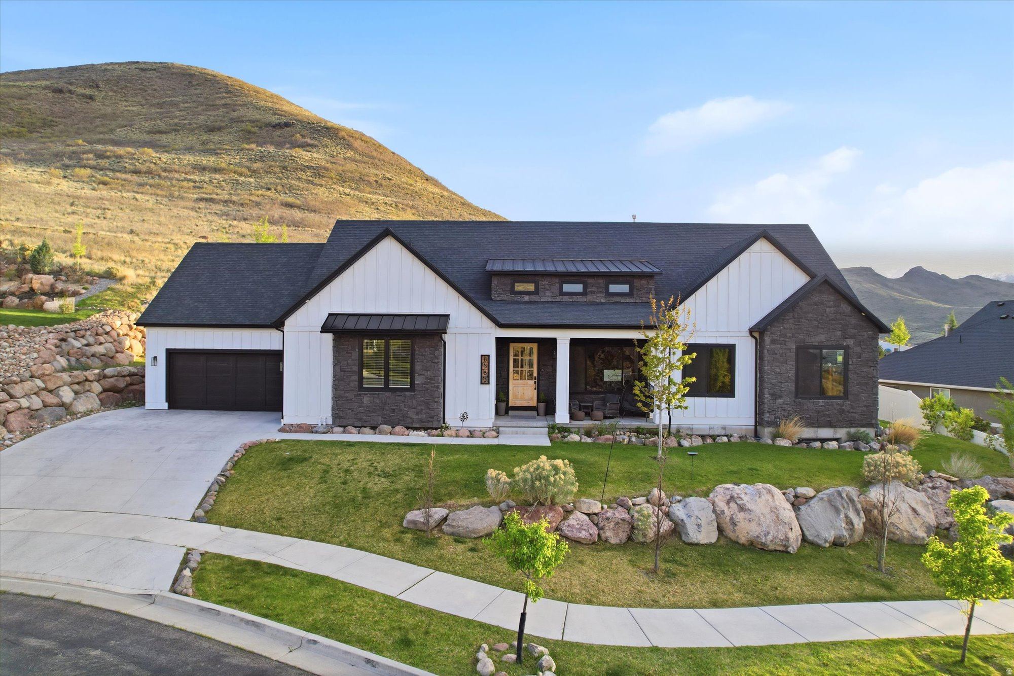 PRICED WELL BELOW MARKET VALUE. WILL GO FAST! Welcome to this stunning home in Herriman, ideally located on a quiet cul-de-sac just a short walk from the Herriman Steps. Situated on .58 acres, this property offers incredible valley and mountain views with beautiful landscaping featuring Sunburst maple, spiral oak, and aspen trees. The main level boasts high ceilings and an open-concept layout centered around a gourmet kitchen with a Sub-Zero refrigerator, perfect for entertaining. The newly renovated basement includes a mother-in-law apartment with a private entrance, offering flexibility for guests or rental income. Major upgrades provide peace of mind, including a new electrical panel, radon mitigation system, three sump pumps with a 25-year warranty, and new HVAC zoning in the basement. Enjoy a unique outdoor setting-while the immediate backyard is more intimate, just steps lead you directly up the mountain to a flat viewing area with incredible panoramic views of the entire valley, creating a one-of-a-kind extension of your outdoor space. Conveniently located near shopping, dining, and entertainment at Mountain View Village, with easy access to popular spots like Slackwater and The Break Sports Grill-this home offers the perfect blend of space, upgrades, views, and location. Square footage figures are provided as a courtesy estimate only and were obtained from county records. Buyer is advised to obtain an independent measurement.