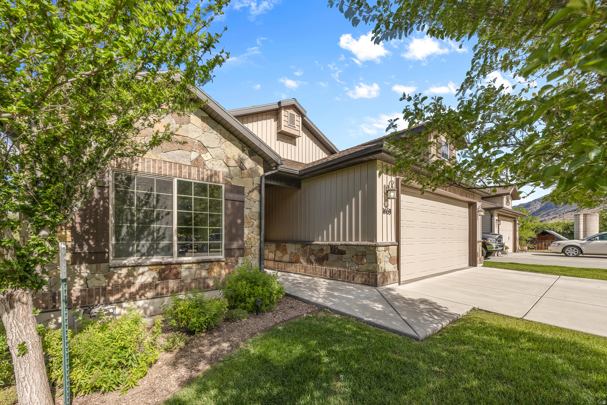 Step inside this beautifully designed, spacious single-level home. The bright, open-concept floor plan is highlighted by vaulted ceilings and a cozy focal-point fireplace. At the heart of the home, the chef-inspired kitchen leaves no detail overlooked, featuring gleaming granite countertops, custom cabinetry, and a large center island.  The generous layout includes large secondary bedrooms and a luxurious primary suite, offering a private retreat complete with a separate soaking tub and walk-in shower. Best of all, this property provides a truly maintenance-free lifestyle. With professional yard care and snow removal completely covered, you can say goodbye to exterior chores and simply enjoy your stunning, move-in-ready home. Schedule your private showing today!