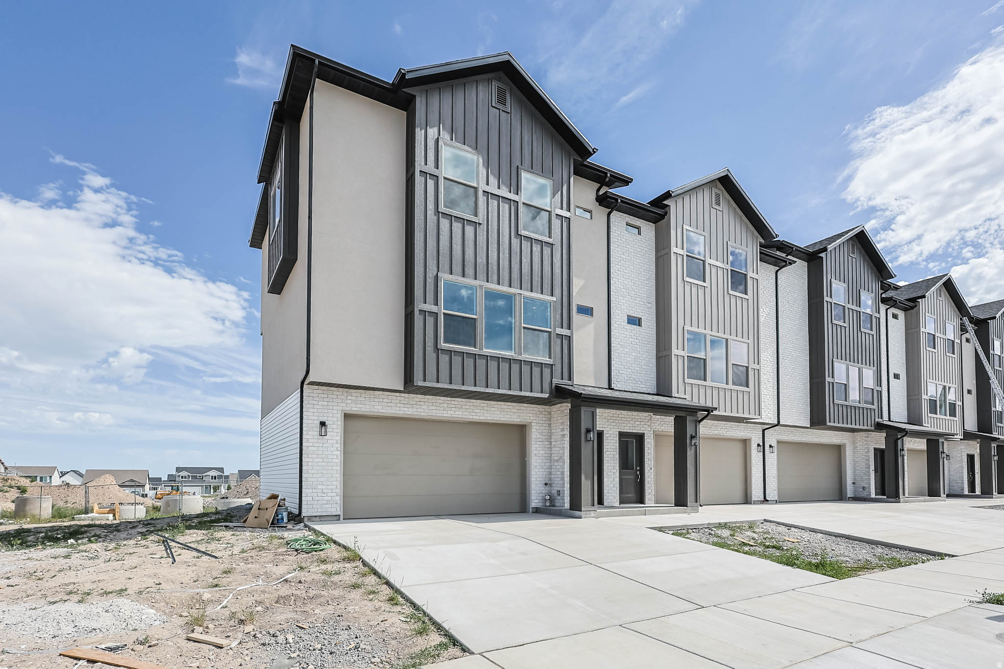 Middle unit, Super Open floorplan that is perfect for gathering. Gorgeous Views!  LVP floors throughout the main floor and in baths. Huge Garage that fits a mega-cab truck and a car. 9' main floor ceilings, Huge pantry, 39" upper cabinets, 7' kitchen island, covered Deck. Come see our Decorated model home.  ~70 days to Finish.  4 units available w/different color packages,  Still time to add upgrades.