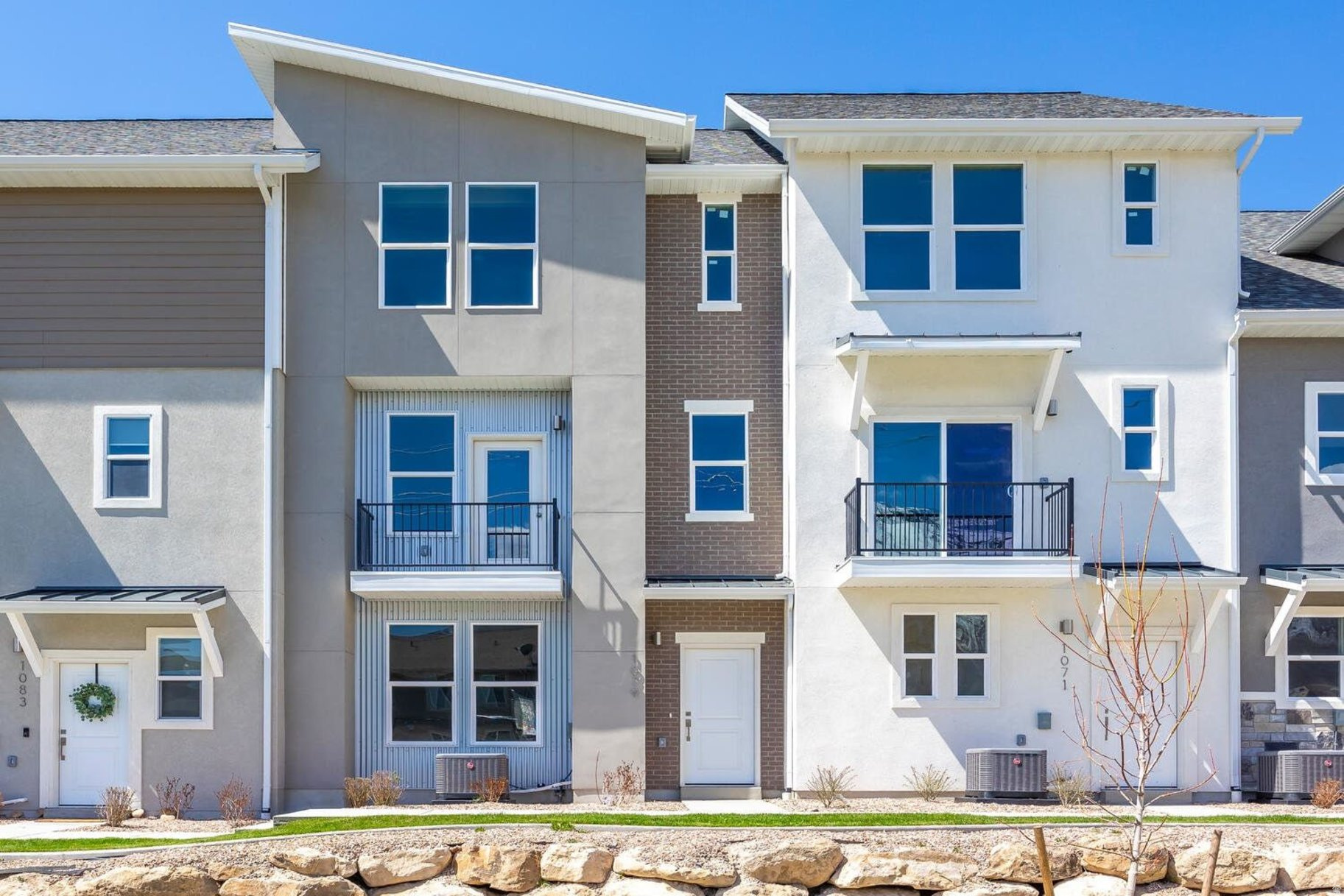 Beautiful three-bedroom townhome at the Ridge at Spanish Fork. This is a three-bedroom Midtown plan that features two ensuite bedrooms, a nice family room, and a large kitchen with a back covered deck. It has a one car attached garage. The Ridge at Spanish Fork is a beautiful townhome community located on the east end of Spanish Fork. The Ridge has a clubhouse with a fitness center, an indoor/outdoor pool, new pickleball courts, and a dog park. The development is conveniently located near shopping (there is a grocery store across the street and Costco is just down the road), restaurants, schools, and only minutes from I-15 and the mouth of Spanish Fork Canyon. The Ridge offers two, three, and four-bedroom floor plans. There is new inventory available and we also work with investors. Come tour the model for more information. Use our preferred lender and receive a $10,000 credit for a rate buydown or closing costs. Photos are of a similar finished unit.