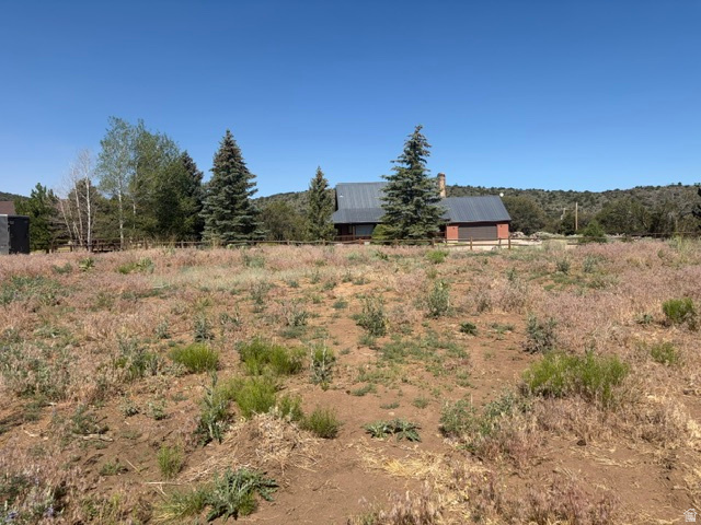Truly a special lot in Pine Valley! This beautiful 0.48-acre parcel has already been cleared of brush and leveled, making it easier to begin planning your mountain retreat. A rock retaining wall adds character and function to the property. Water is connected ($3600 value) with a working spigot already in place; a septic system will be required.( perc test completed) Enjoy a peaceful setting tucked away from the main roads while still offering convenient year-round access. Located at approximately 6,700 feet elevation, Pine Valley offers towering pines, cool mountain air, and a serene lifestyle surrounded by nature. Explore nearby hiking and biking trails, enjoy the local restaurant and ice cream shoppe, and watch for abundant wildlife including mule deer, wild turkeys, and hummingbirds. Best of all, you're only about 35 minutes from St. George, yet you'll feel worlds away in this charming mountain community. A rare opportunity to build your dream home in one of Southern Utah's most beautiful settings.